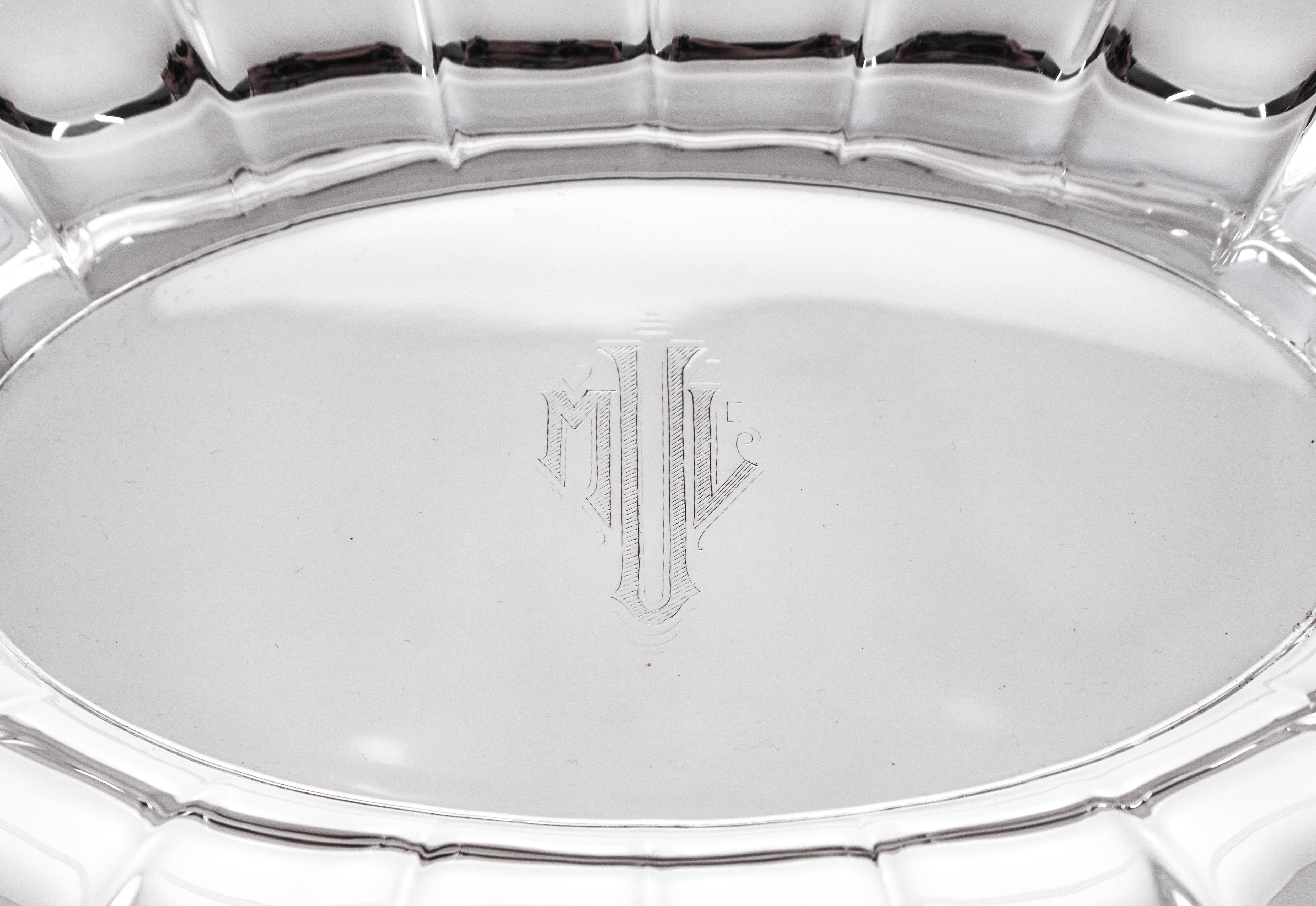 This sterling silver breadbasket has a scalloped rim and flares up on each end. The centre is completely flat which is perfect for serving. In the centre there is an Art Deco Hans engraved monogram. It’s the perfect size for cookies or biscottis.