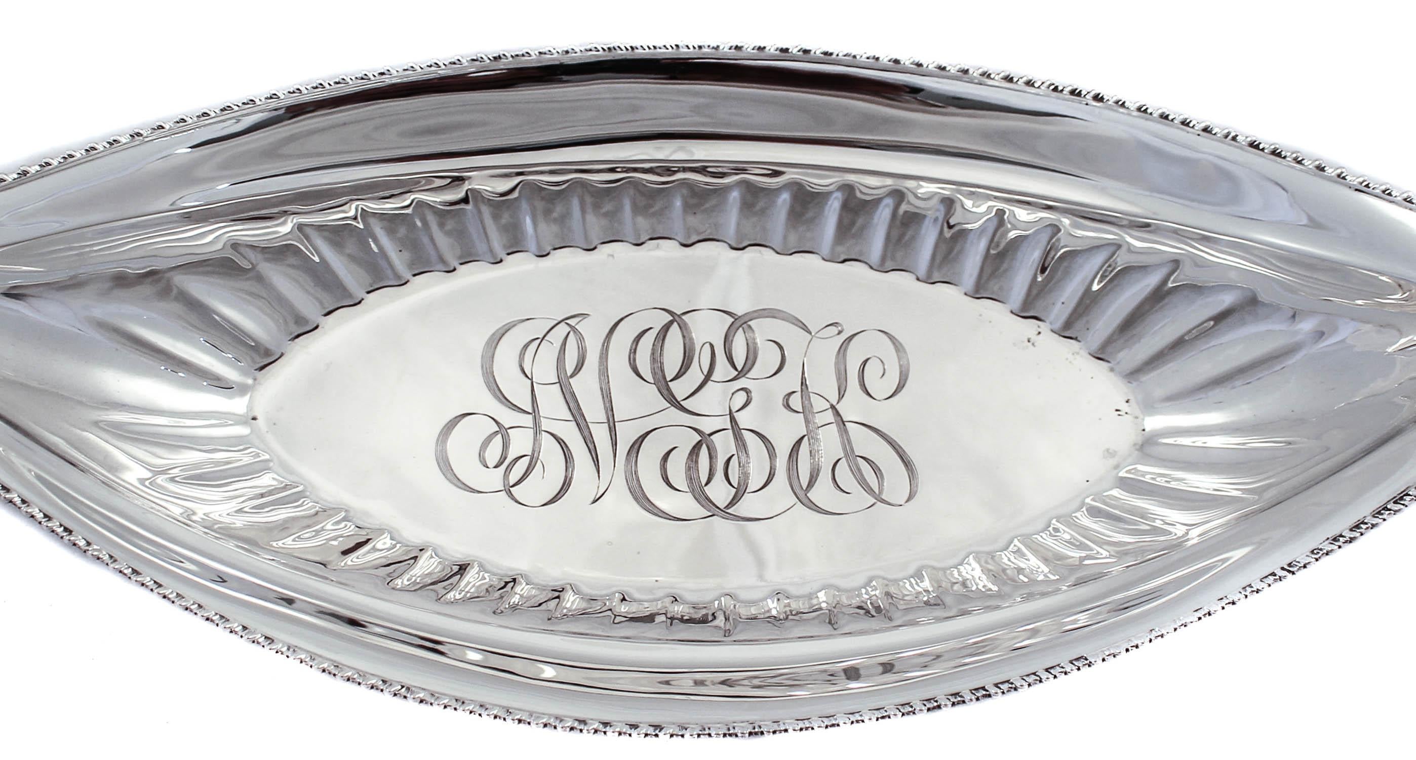 We are happy to offer this lovely sterling silver breadbasket by Towle Silversmiths. It has a canoe-like shape which is very interesting. Unlike most breadbaskets that are rounded off at the ends, the ends come to a point. Truly a classic design, it