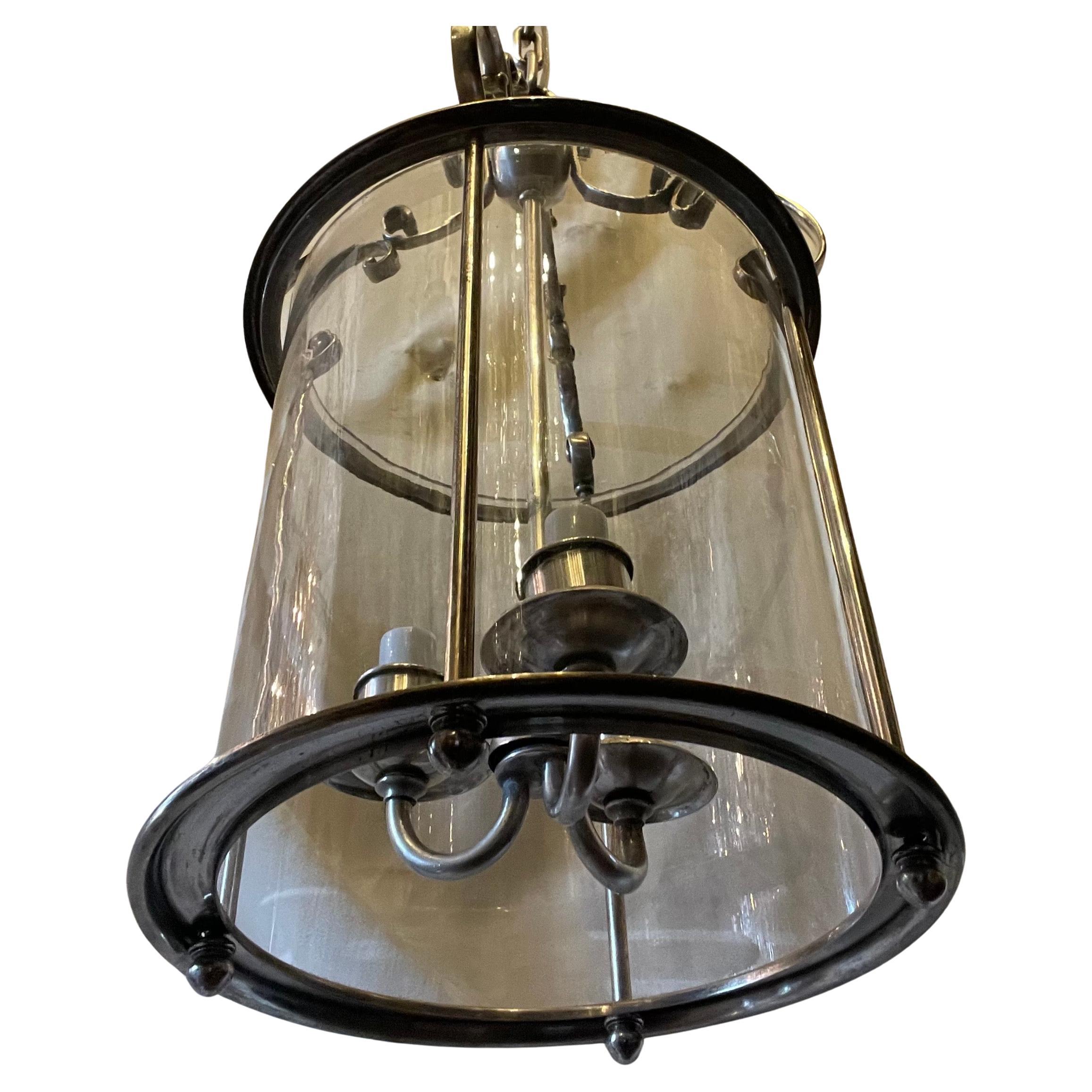 20th Century Sterling Bronze Co. Pair Of Polished Nickel Bronze Blown Glass Lantern Fixtures For Sale