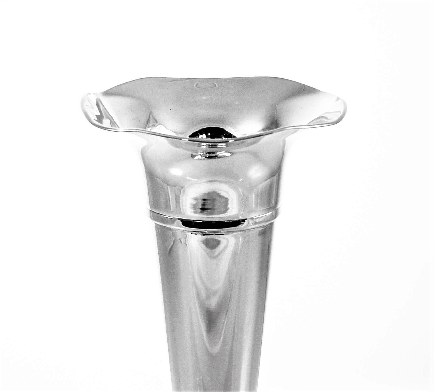 A simple tapered shape sterling bud vase with a scalloped top. Goes with any decor or style. For those areas in your house (or office) that need brightening up but aren’t big enough to hold a full-size vase end-tables, powder rooms, desks and vanity