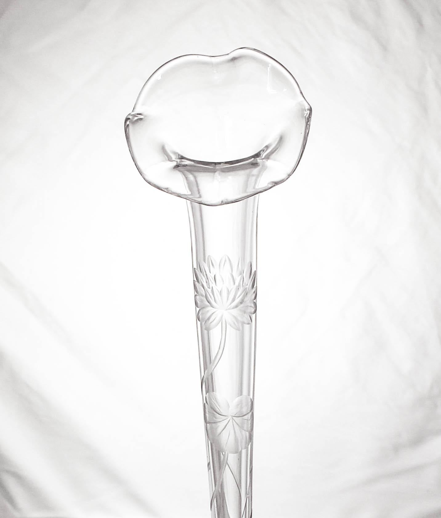 We proudly offer this sterling silver bud vase by William B. Durgin. Durgin was founded in 1853 and eventually became a division of the Gorham Manufacturing Company. It has a sterling silver base and a crystal liner with a fluted top. On the glass