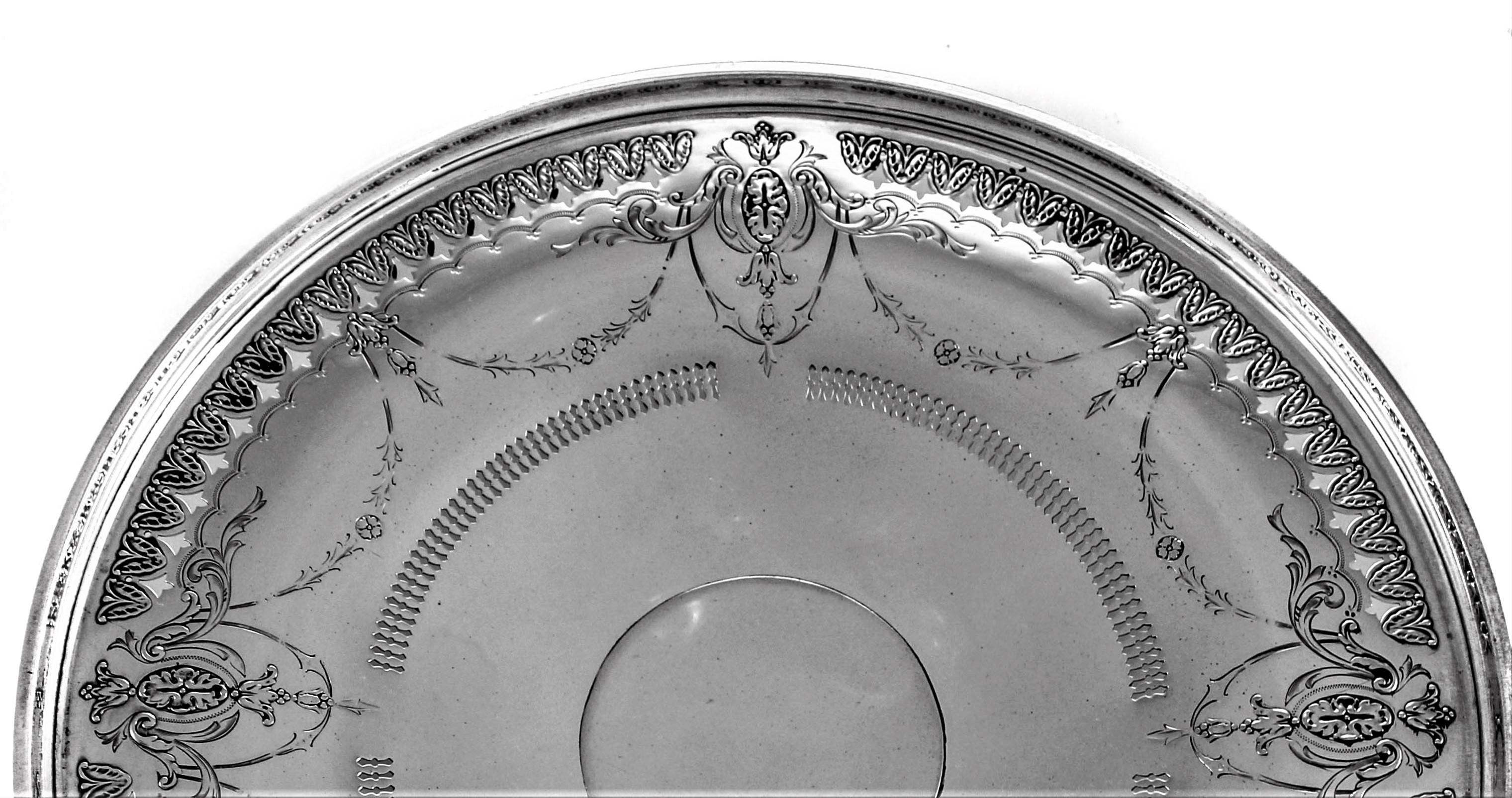 We are proud to offer this lovely sterling dish by Towle Silversmiths. It stands on a pedestal, not weighted. Around the edge, a pierced design intermittently with the etching pattern. Another pierced work pattern frames the centre.