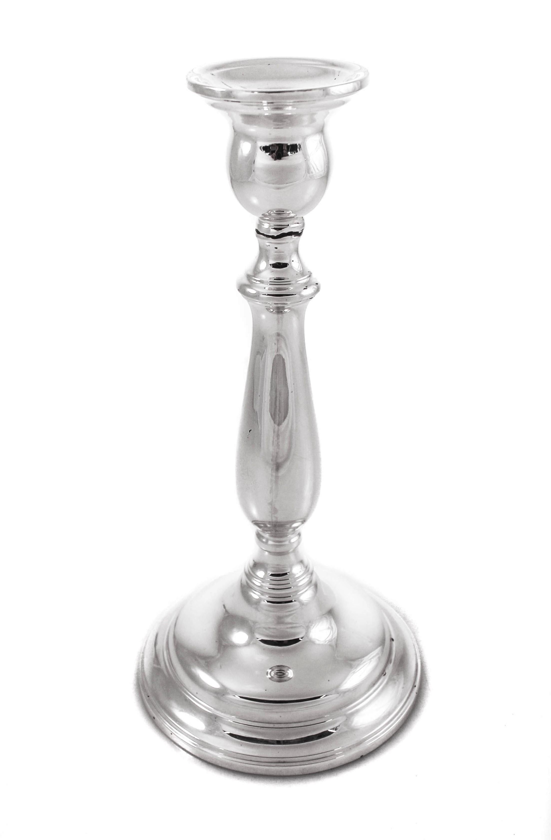 During and right after WWII, luxury items were not too common. And when they were, they were sparse and unadorned. These sterling silver candlesticks from that period are a perfect example; simple and understated. They have a pretty silhouette and