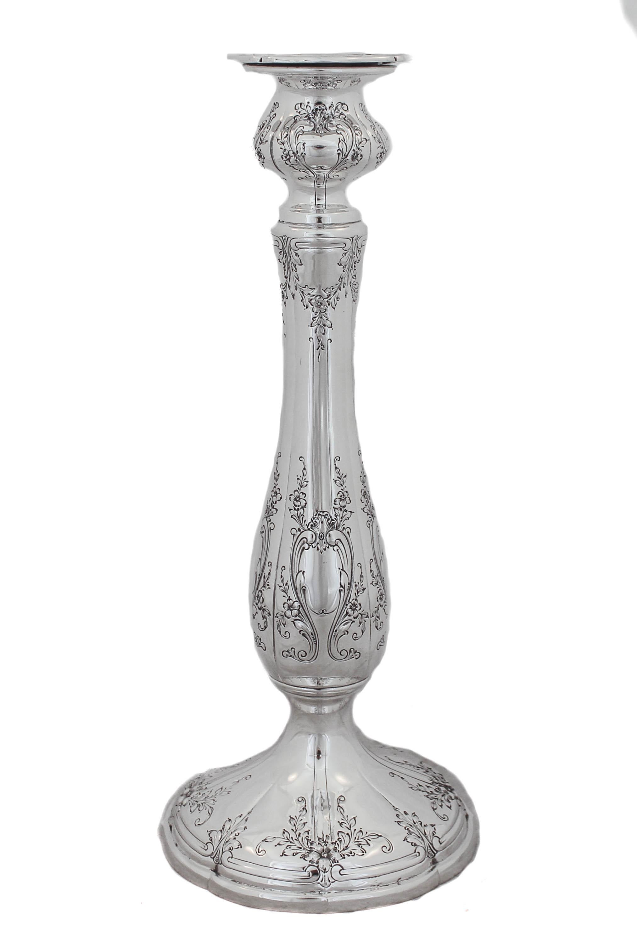 This sterling silver candlesticks are simply gorgeous!! They are 12 inches tall and have a lovely silhouette. There are garlands and flowers from top to bottom. Notice the workmanship around the scalloped base. Every detail was done to perfection!