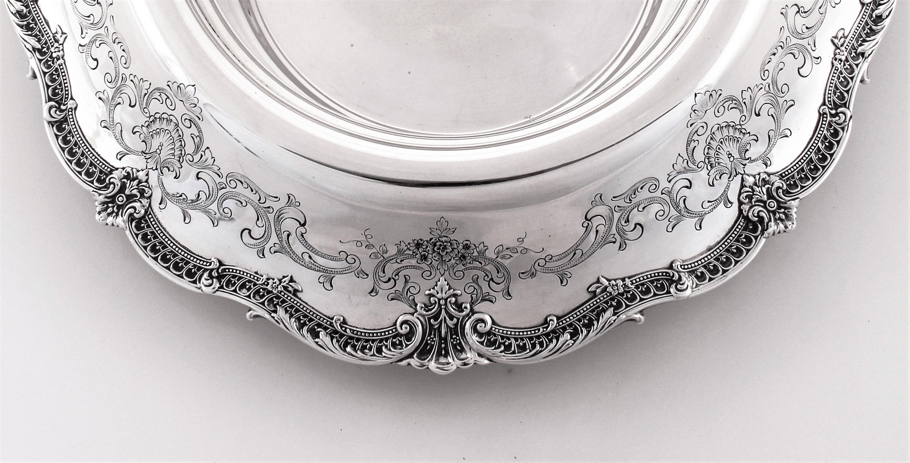 We are proud to offer this sterling silver centerpiece bowl by Graff, Washbourne and Dunn of New York. It is a beautiful antique piece from a period when entertaining was an art onto itself and there was an appreciation for the finer things in life.