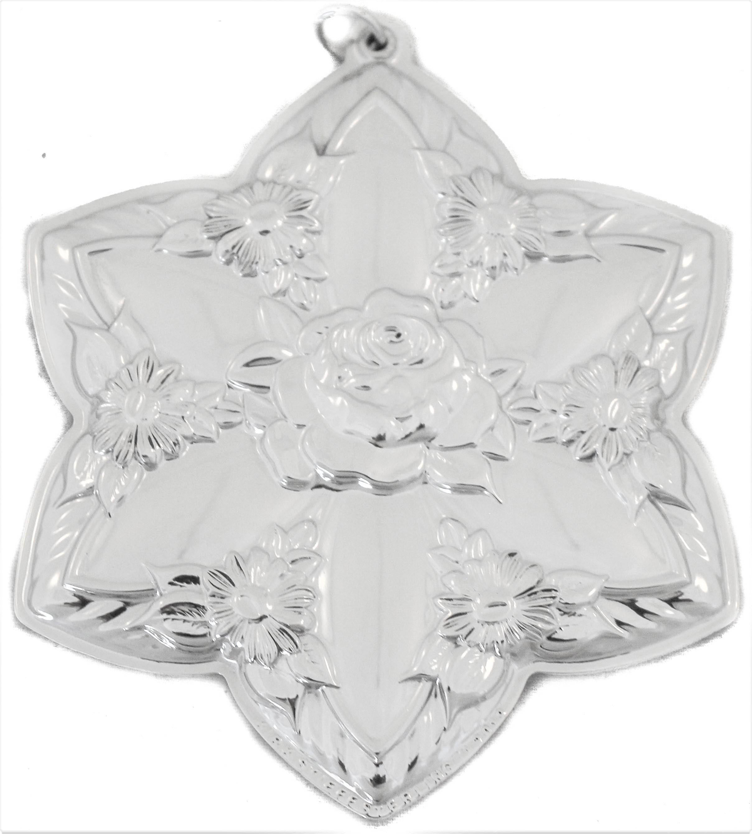 We are happy to offer you this sterling silver Christmas ornament by the Kirk-Stieff Silver Company of Baltimore. It is the star with flowers along the edge as well as a larger flower in the center. Both sides have the same design so you need not
