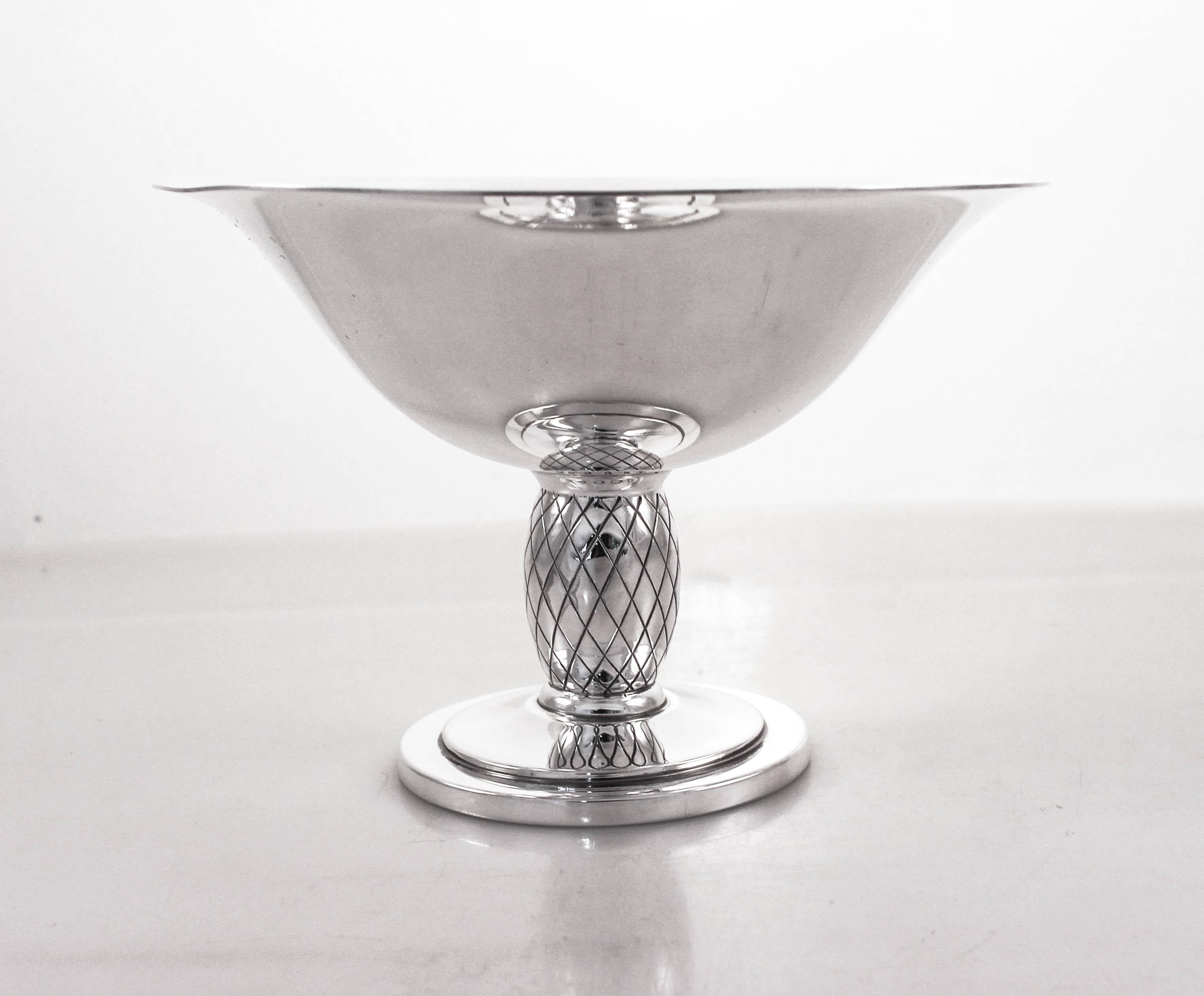 Proudly offering a pair of sterling silver compotes by one of Denmark’s foremost silversmiths, CC Hermann. Designed in an Art Deco pattern, both the top and base are clean while the stem has a triangular/diamond pattern. The compotes are nice and