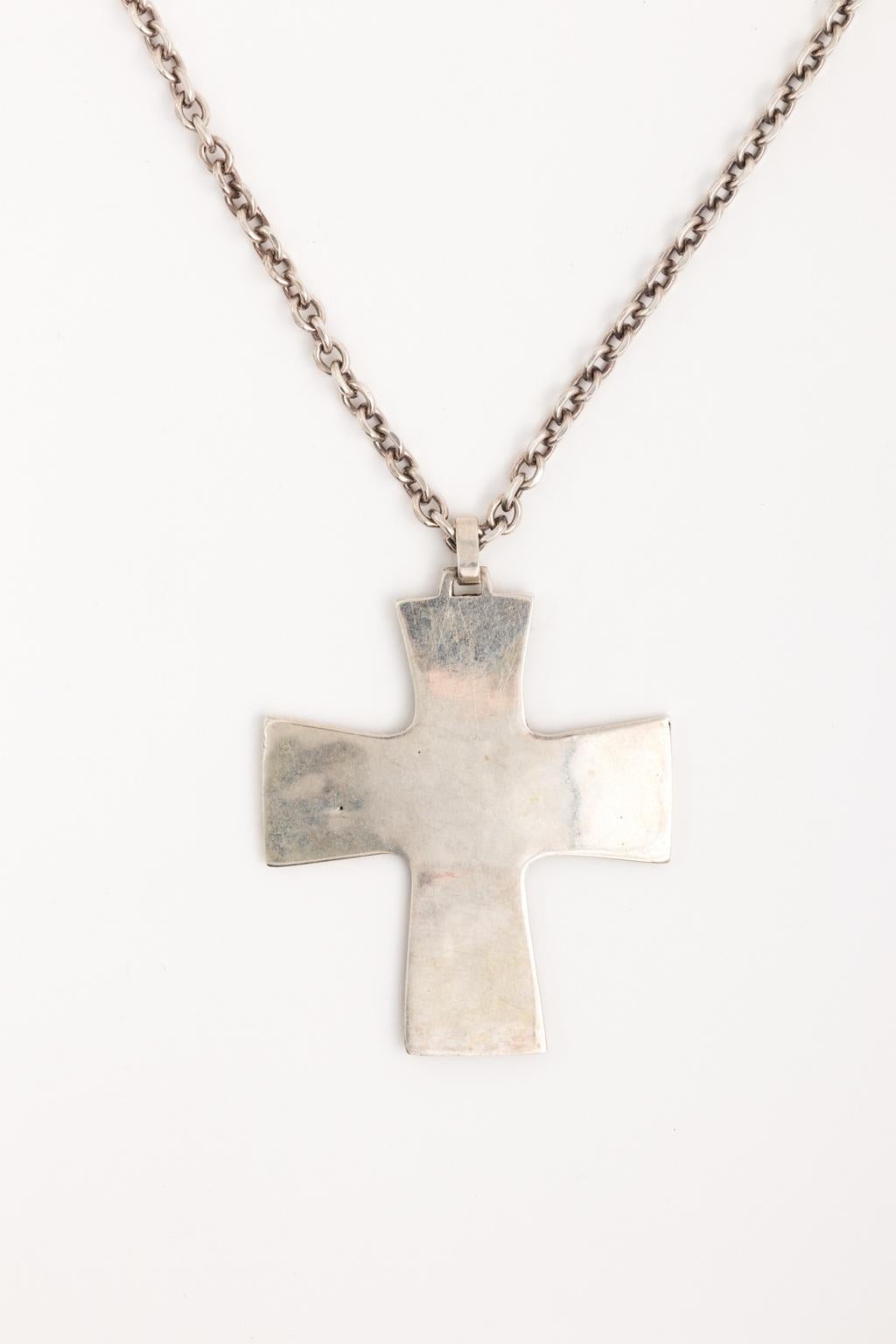 Circa 1890-1910 sterling silver handmade Maltese cross with hand carved twelve apostles and chain. Hallmark is from Austria and is on bottom left of cross. The chain measures 32.00 Inches long.
