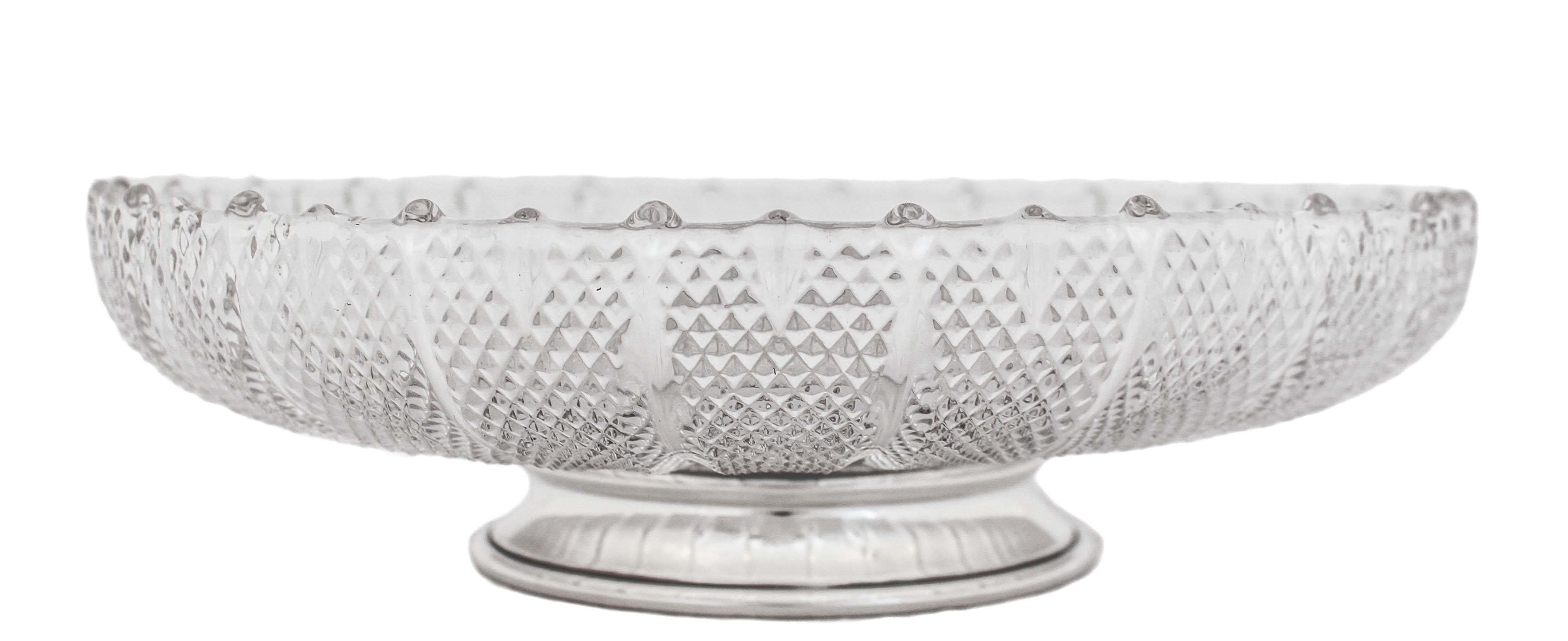 We are happy to offer you this crystal bowl with a sterling silver pedestal by S. Kirk and Sons of Baltimore, Maryland.  Famous for their iconic “Repousse” and “Rose” patterns, this is very different and unique to the maker.  Unlike their other