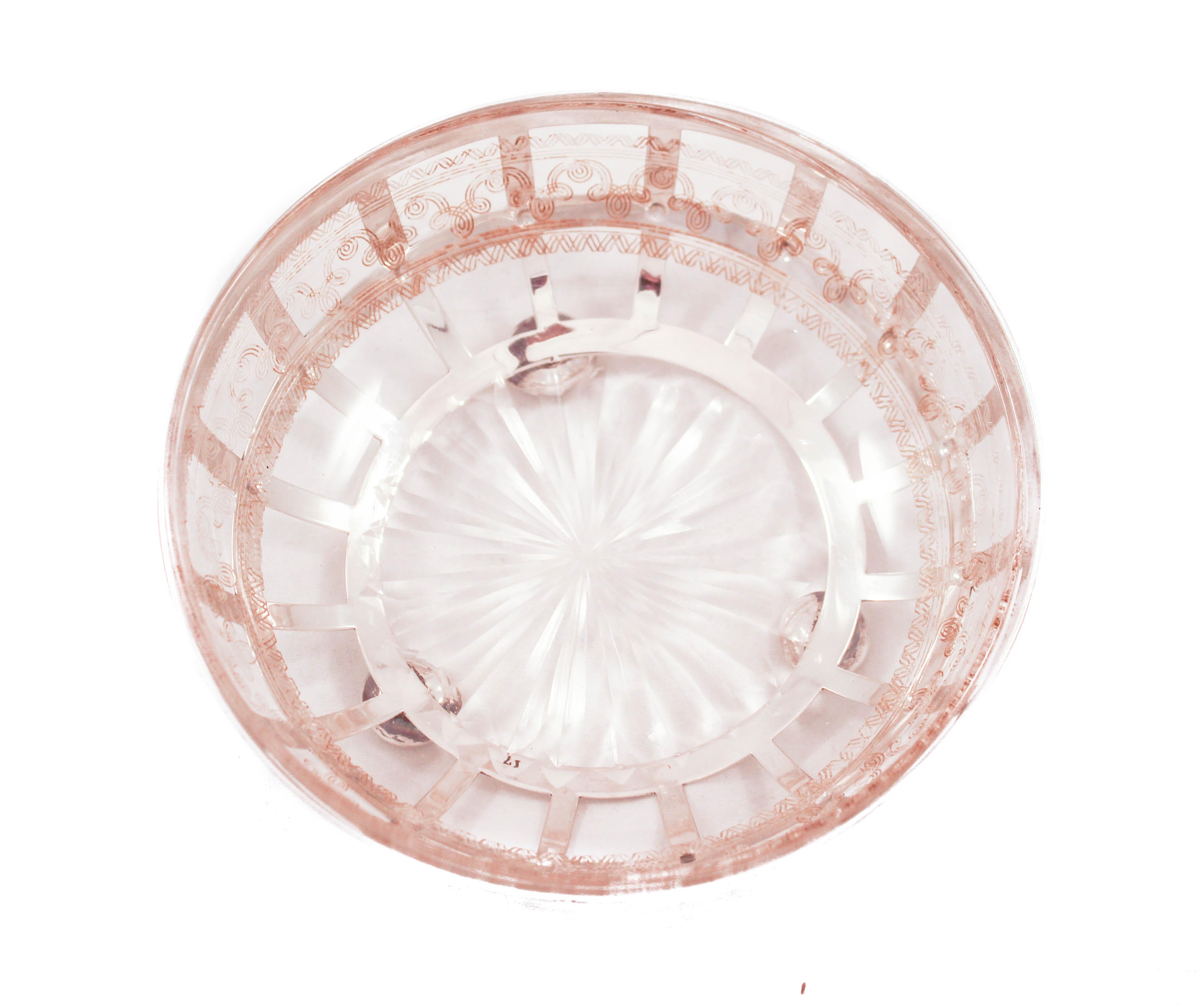 This sterling silver dish has an Art Deco design with its square cutouts and ball-feet. However, the glass liner, original to this piece, has an acid-etched pattern around the edge and a starburst in the floor center. An interesting mix of modern