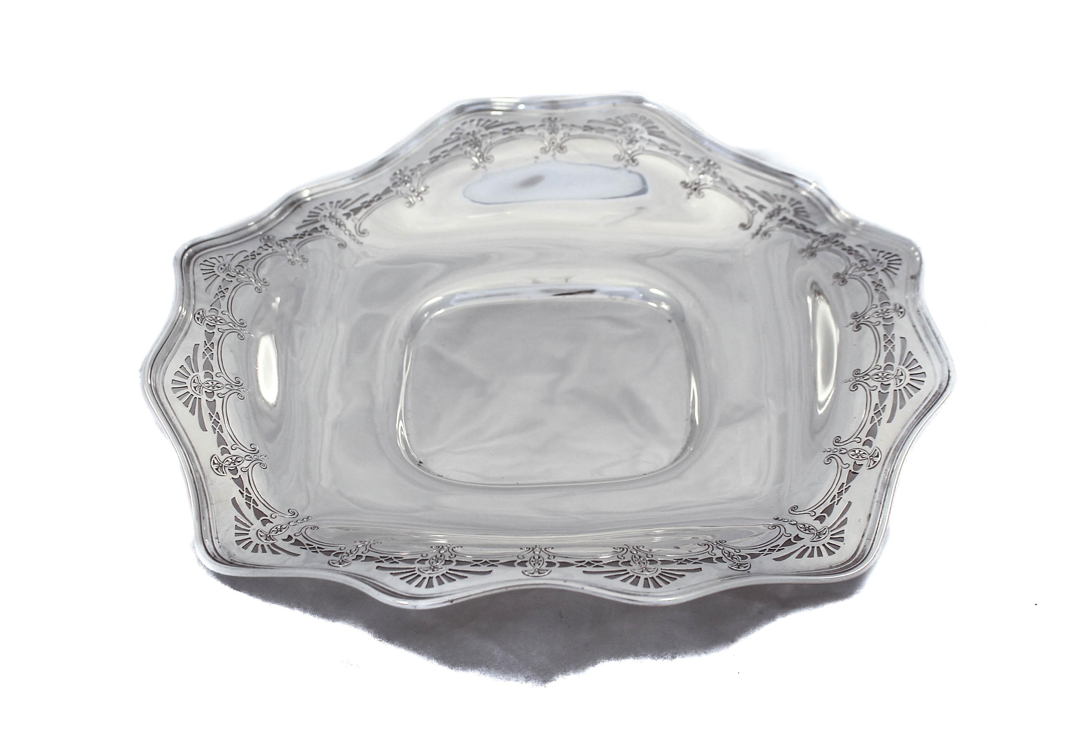 We are thrilled to offer this sterling silver dessert tray by the Frank Whiting Silver Company. 
It has a fluted rim and pretty cutout work along the edge. It has a double border, what a nice surprise! It’s shaped like a square but without the
