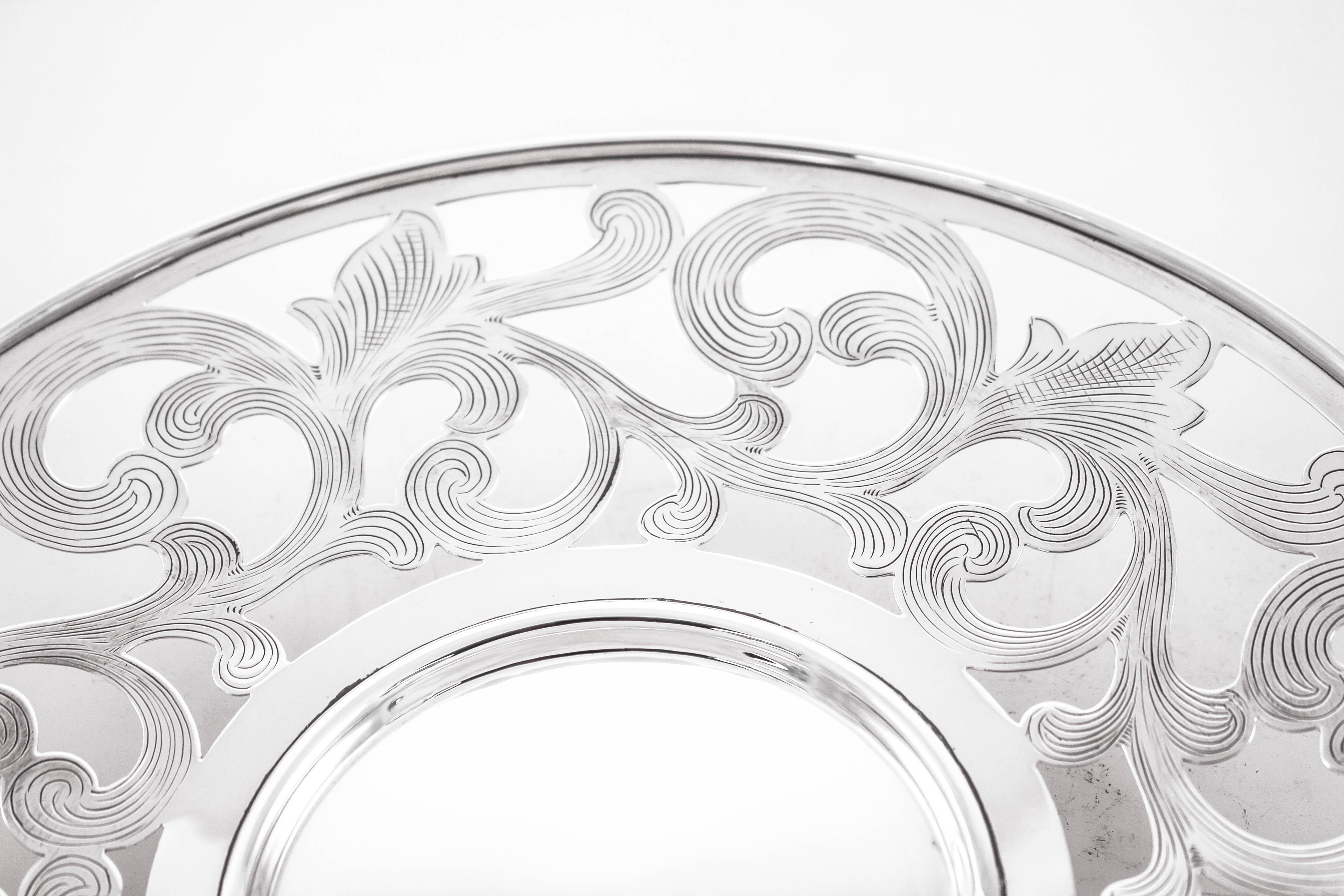 We are proud to offer this sterling silver reticulated dish on a pedestal. The perfect size and shape for casual entertaining. Swirls abound with fine etching on the inside. The pedestal is not weighted and lifts the dish off the surface.