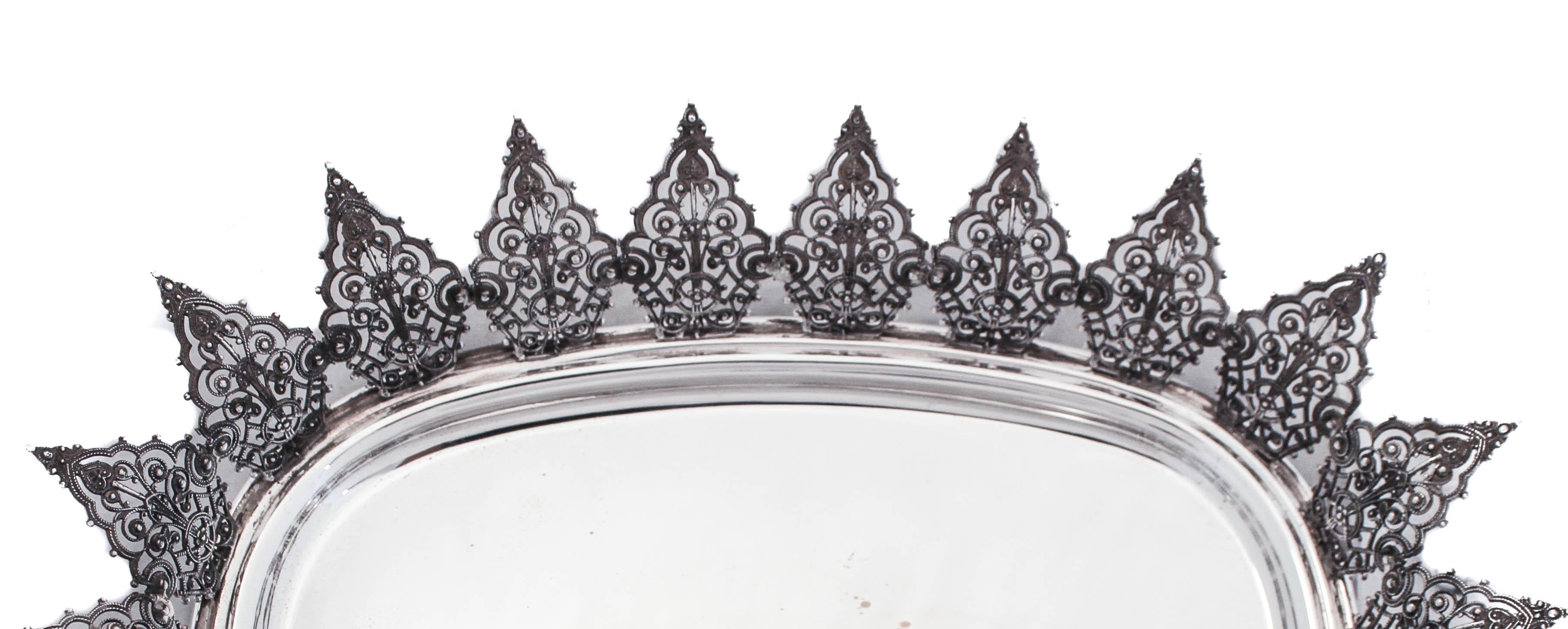 Being offered is a sterling silver Italian oblong dish from the 1960’s — think Federico Fellini and Marcelo Mastroianni in La Dolce Vita. It is smooth and flat in the center but but beware, around the edge is a crown-like design with spikes that