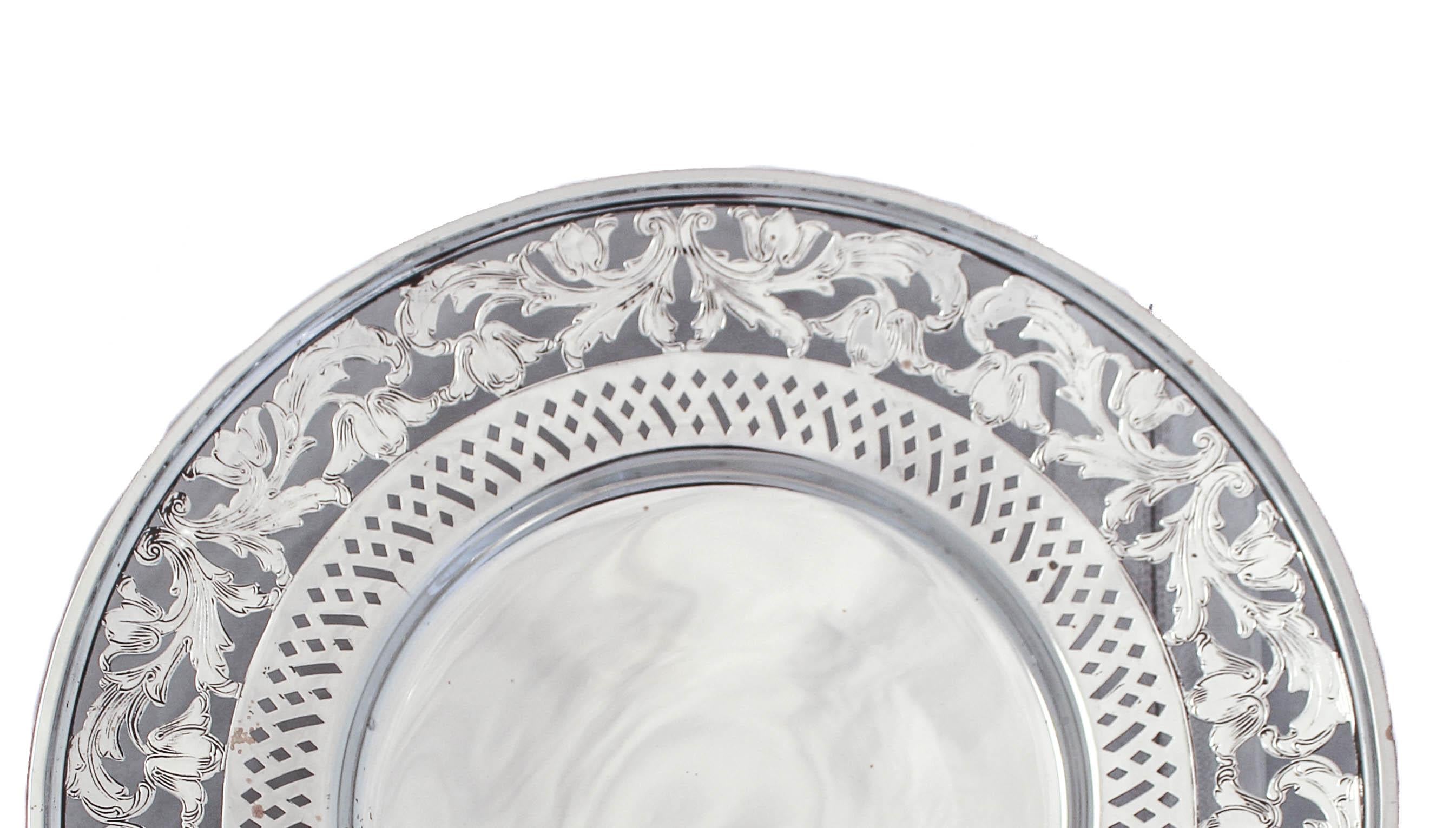 Delighted to offer this sterling silver dish on a pedestal by the Webster Silver Company. It has a lovely floral cutout design approximately one inch wide going around the edge. Around the inner-center there is a geometric cutout pattern. It stands