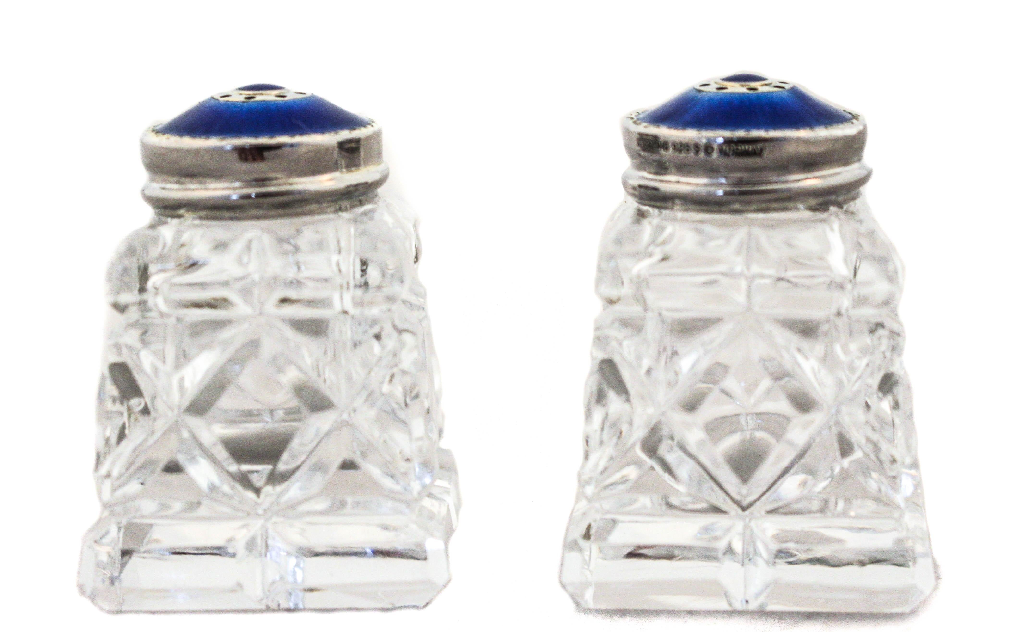 These beautiful sterling silver and royal blue enamel salt shakers come in their original box.  Made in Norway in the post war 1940’s, they are in mint condition.  The dark blue covers really pop out and give color to your table.  The salt never