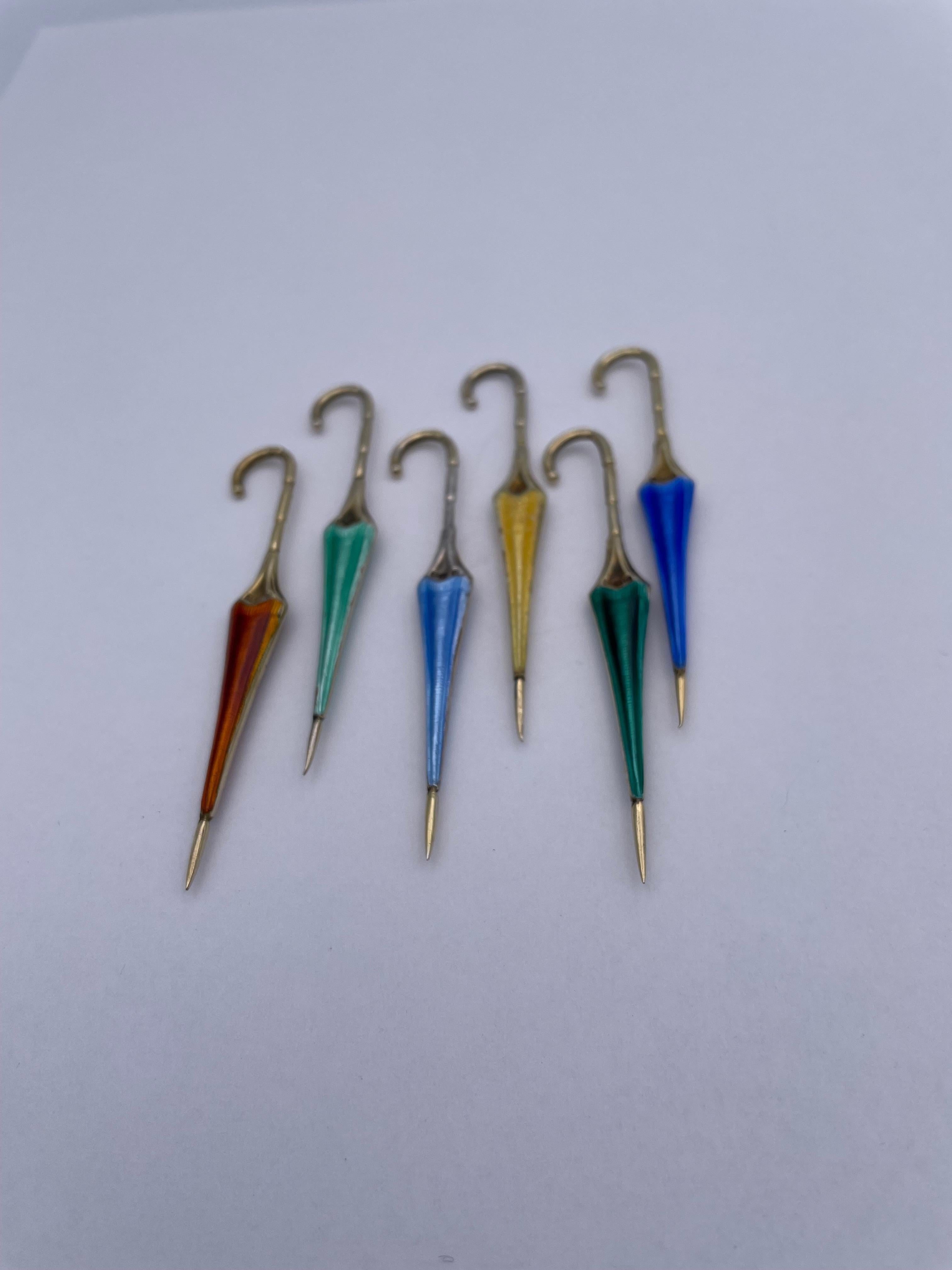 Most appealing set of six hors d'oeuvres servers:  figural umbrellas.  Sterling silver with gilt tips and multi-color guilloche enamel.  Each one is 2 3/4