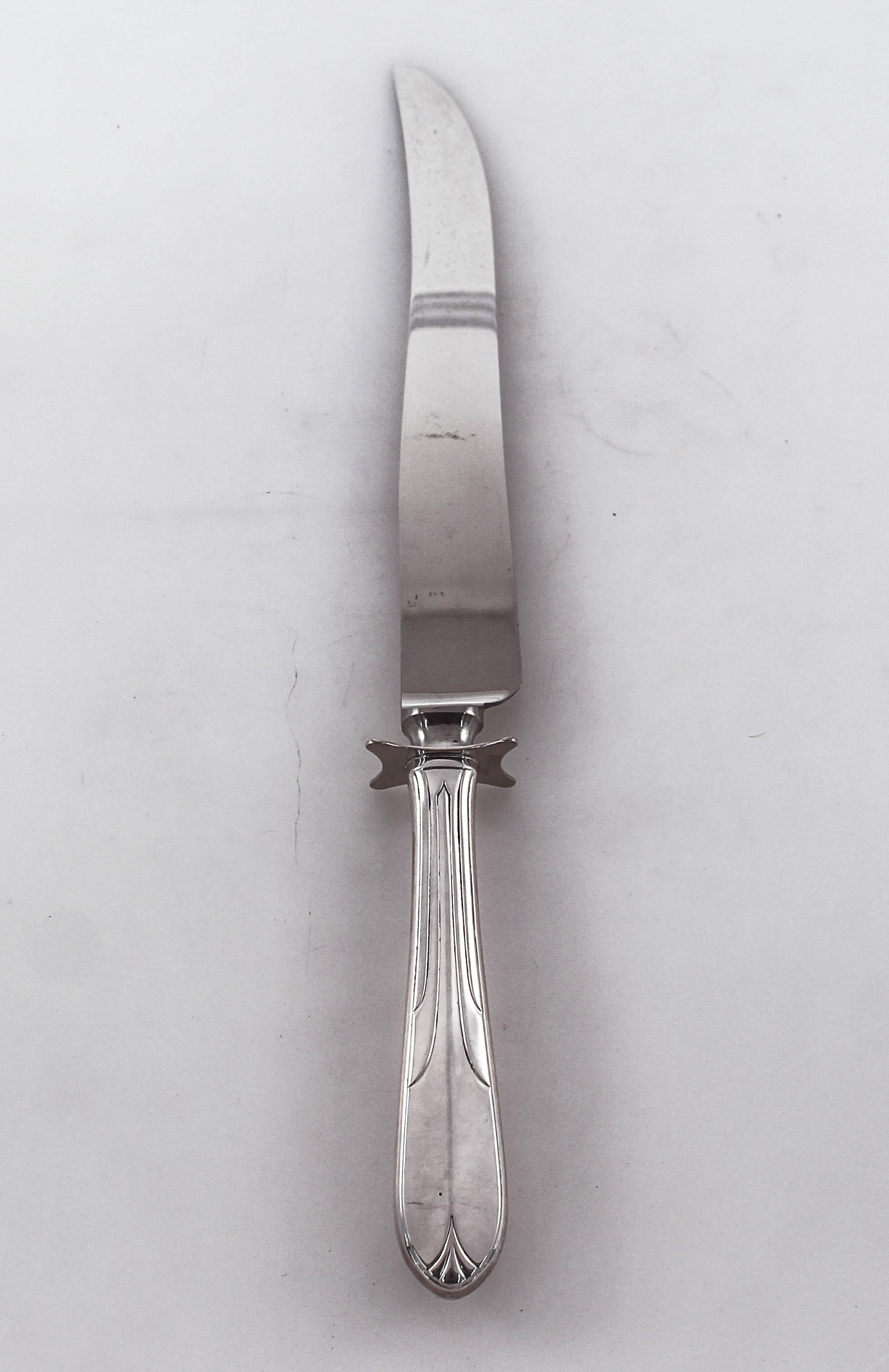 We are delighted to offer this sterling silver carving fork and knife set in the “Overture” pattern by National Silver Co., of NY. It has a distinctively Art Deco design, reminiscent of the Chrysler Building of 1930. These two pieces are extra