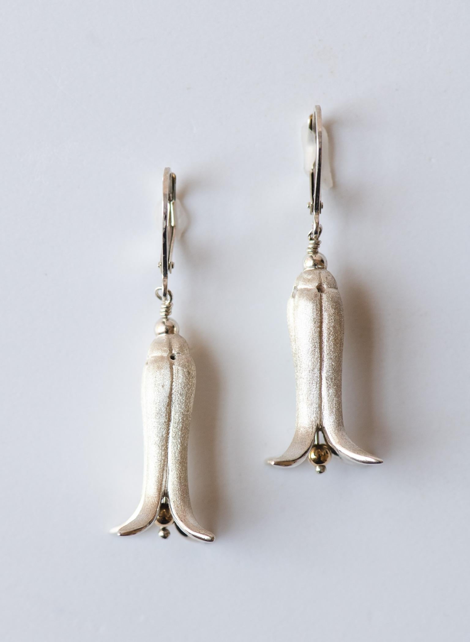 Sterling Silver Fawn Lily Earrings. Elegant and Timeless. Hand carved using a jewelers lathe. 
And cast in sterling using the age old lost wax process. 