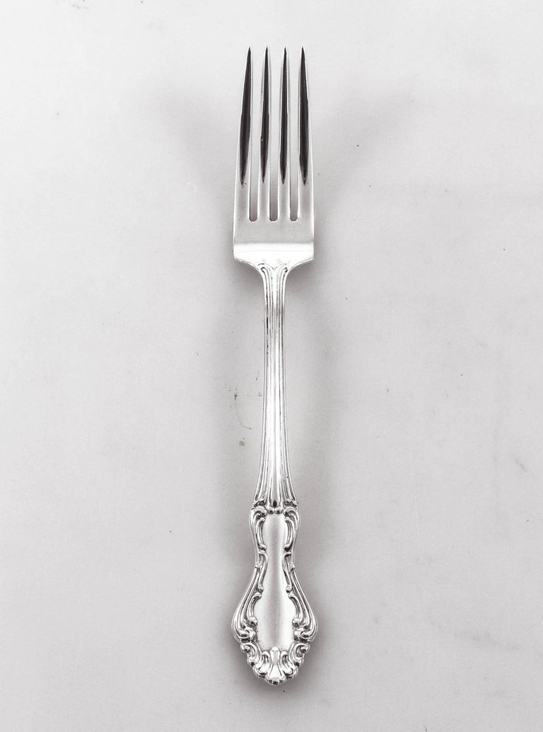 We are proudly offer a set of sterling silver flatware. This is a service for twelve and includes a dinner fork and knife, salad fork, soup and dessert spoons, a total of sixty pieces. Each piece has been meticulously polished and restored to its