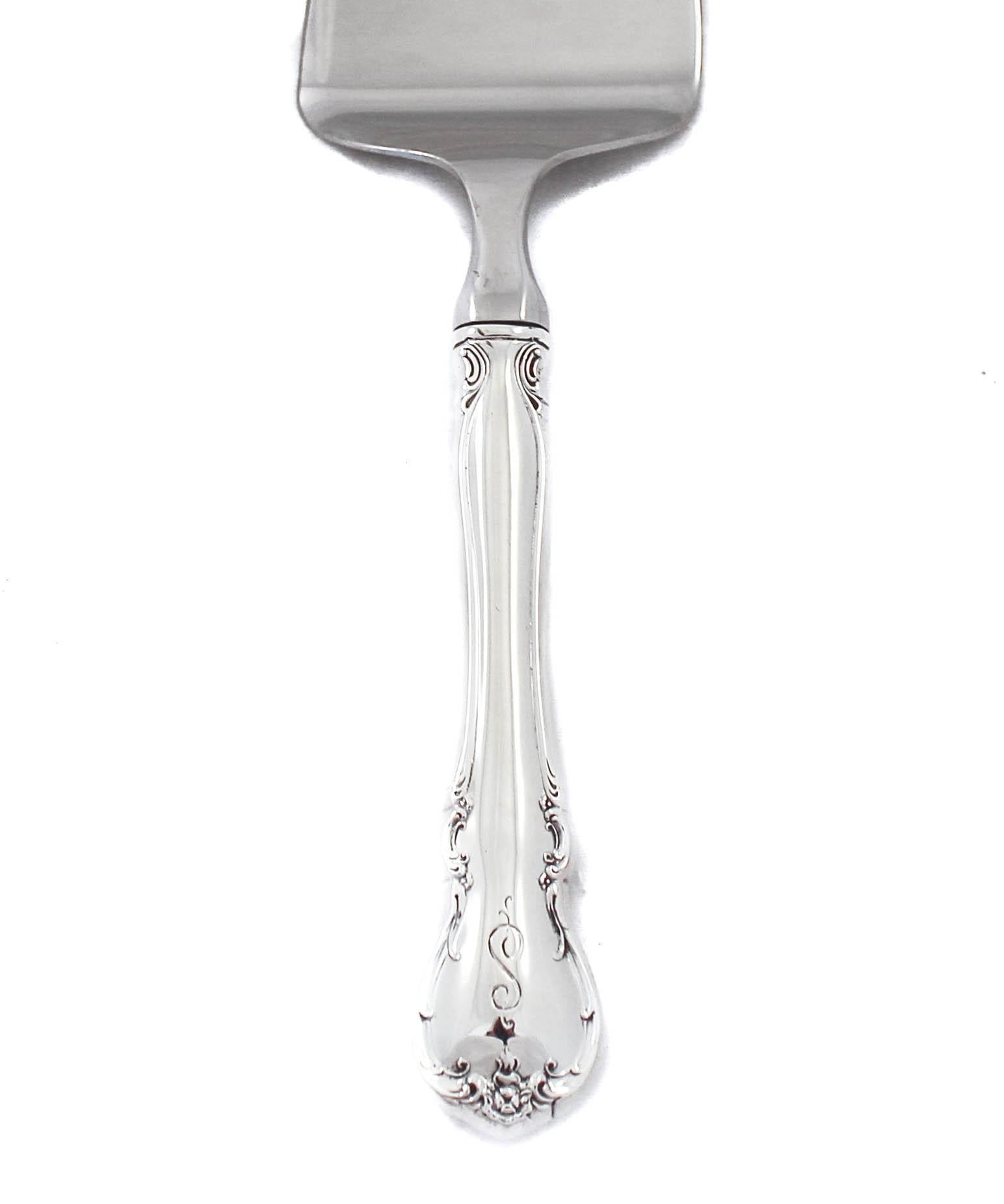 Being offered is a sterling silver server in the French Provincial pattern by Towle Silversmiths. The pattern is understated and delicate. There is a hand engraved script S on the handle.