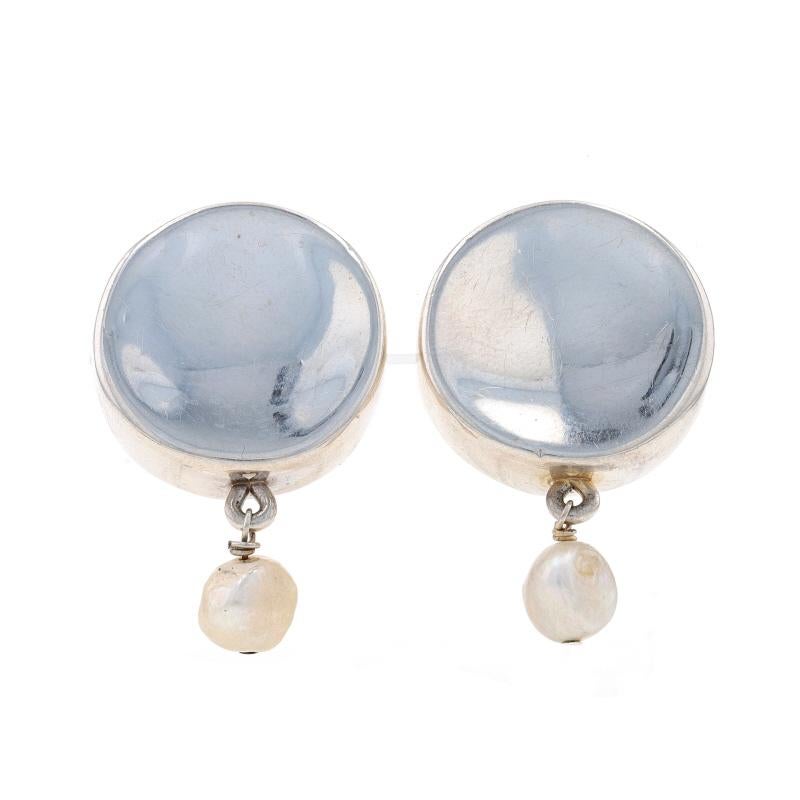 Metal Content: Sterling Silver (resin filled)

Stone Information
Freshwater Pearls
Color: White

Style: Dangle
Fastening Type: Clip-On Closures
Theme: Concave Circles

Measurements
Tall: 1 1/2