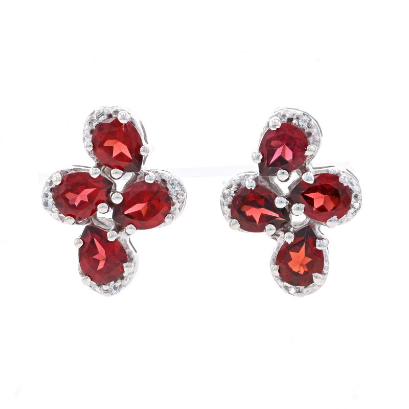 Metal Content: Sterling Silver

Stone Information

Natural Garnets
Carat(s): 3.00ctw
Cut: Pear
Color: Red

Natural White Topaz
Carat(s): .08ctw
Cut: Round

Total Carats: 3.08ctw

Style: Large Cluster Stud
Fastening Type: Butterfly