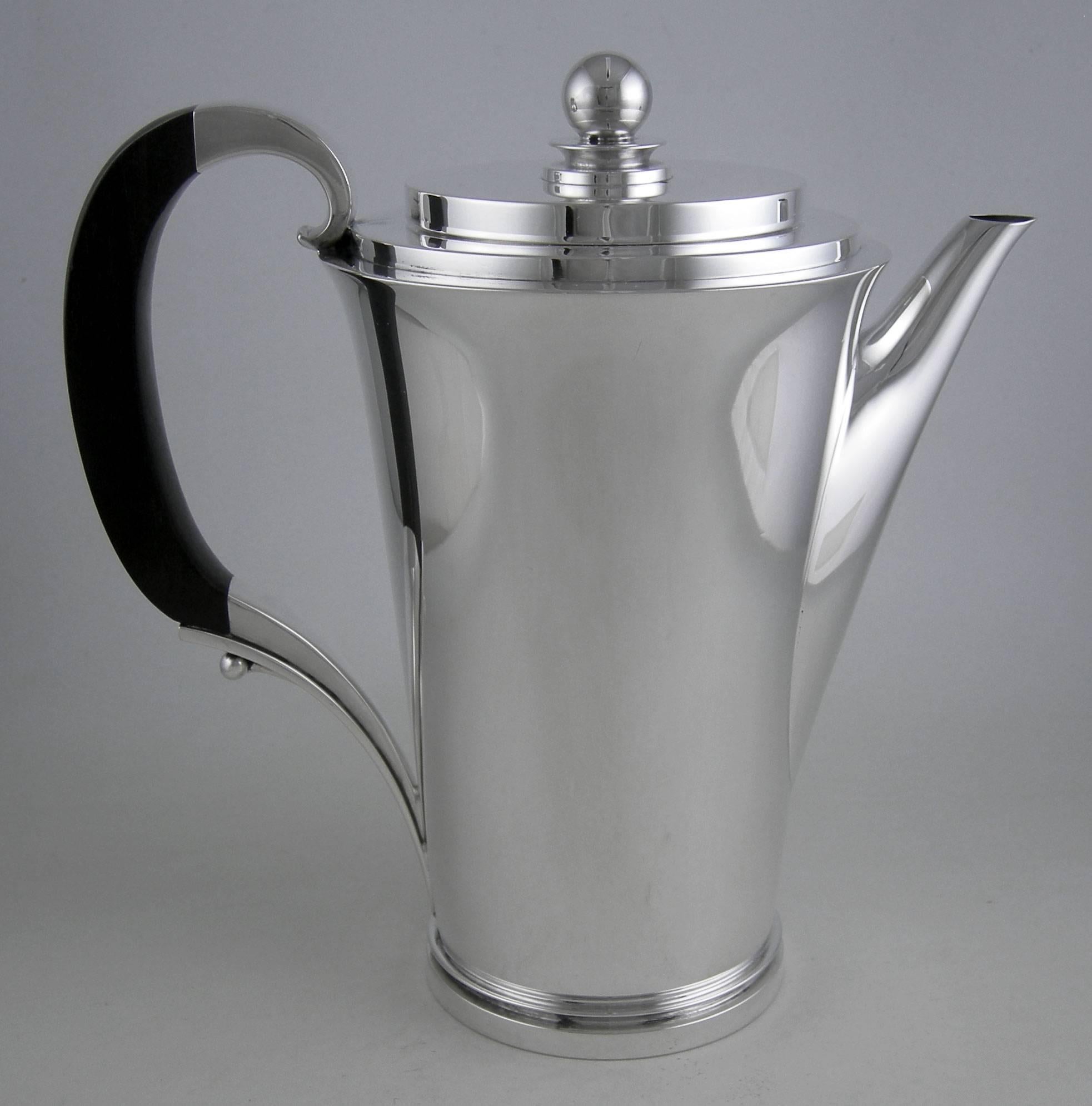 Sterling Georg Jensen Pyramid (1930) three-piece coffee set.

Rare and desirable!

Measures: Coffee pot: 7 3/4