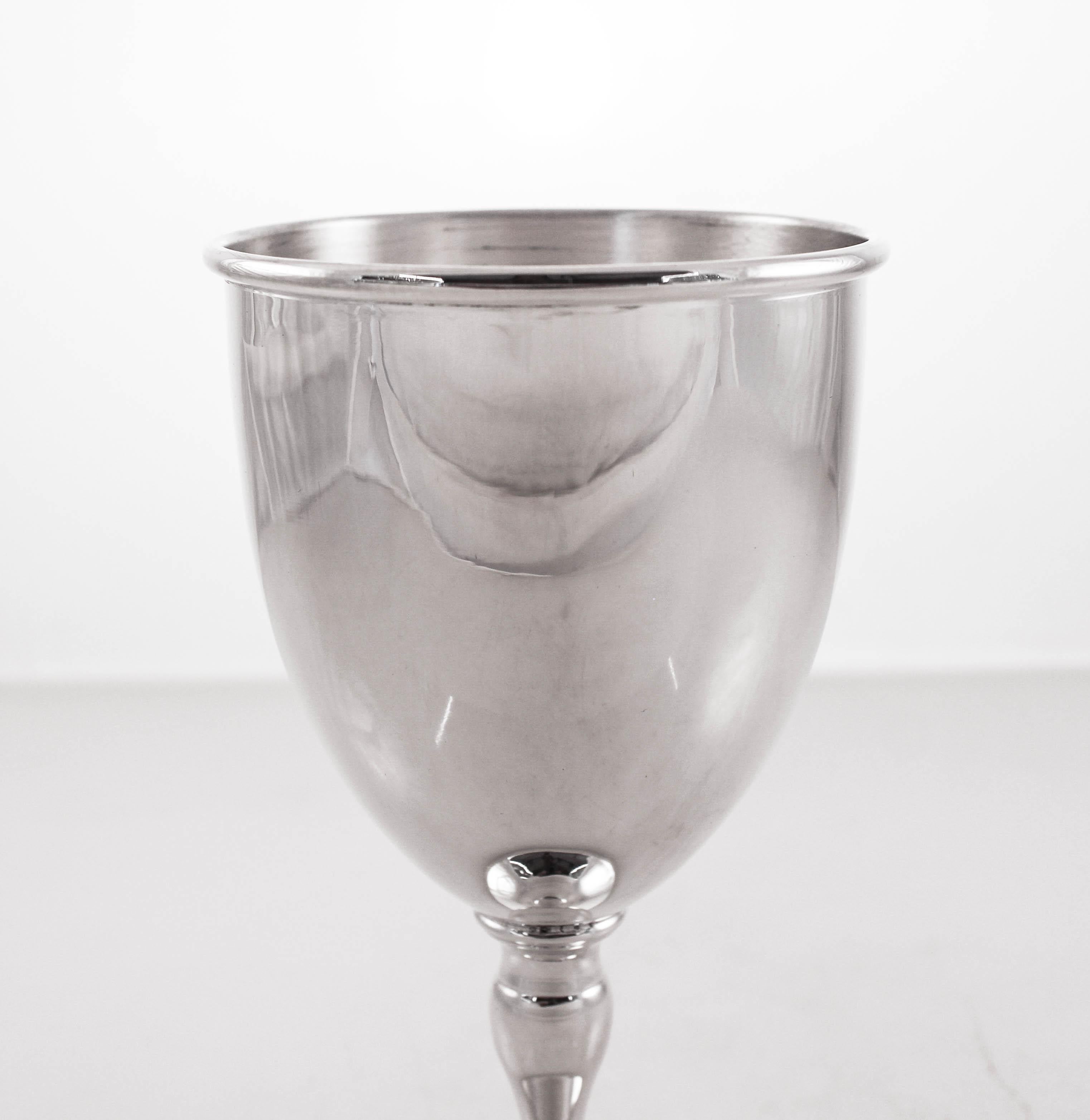 A sterling silver goblet will enhance any dinner table. Elegant and understated, it has no etchings or decoration on it. Just a clean, midcentury feel. Perfect for a synagogue or church service. So whether for holidays, Shabbat, or just for the