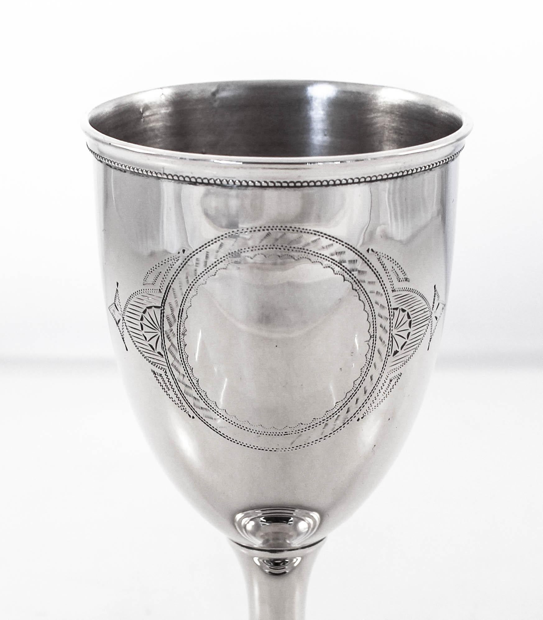 We are delighted to offer this sterling silver goblet from the late 19th century. Understated and elegant it is a rare treasure. It has a pretty motif around the base and rim and has a cartouche in the center for you to personalize with a monogram.