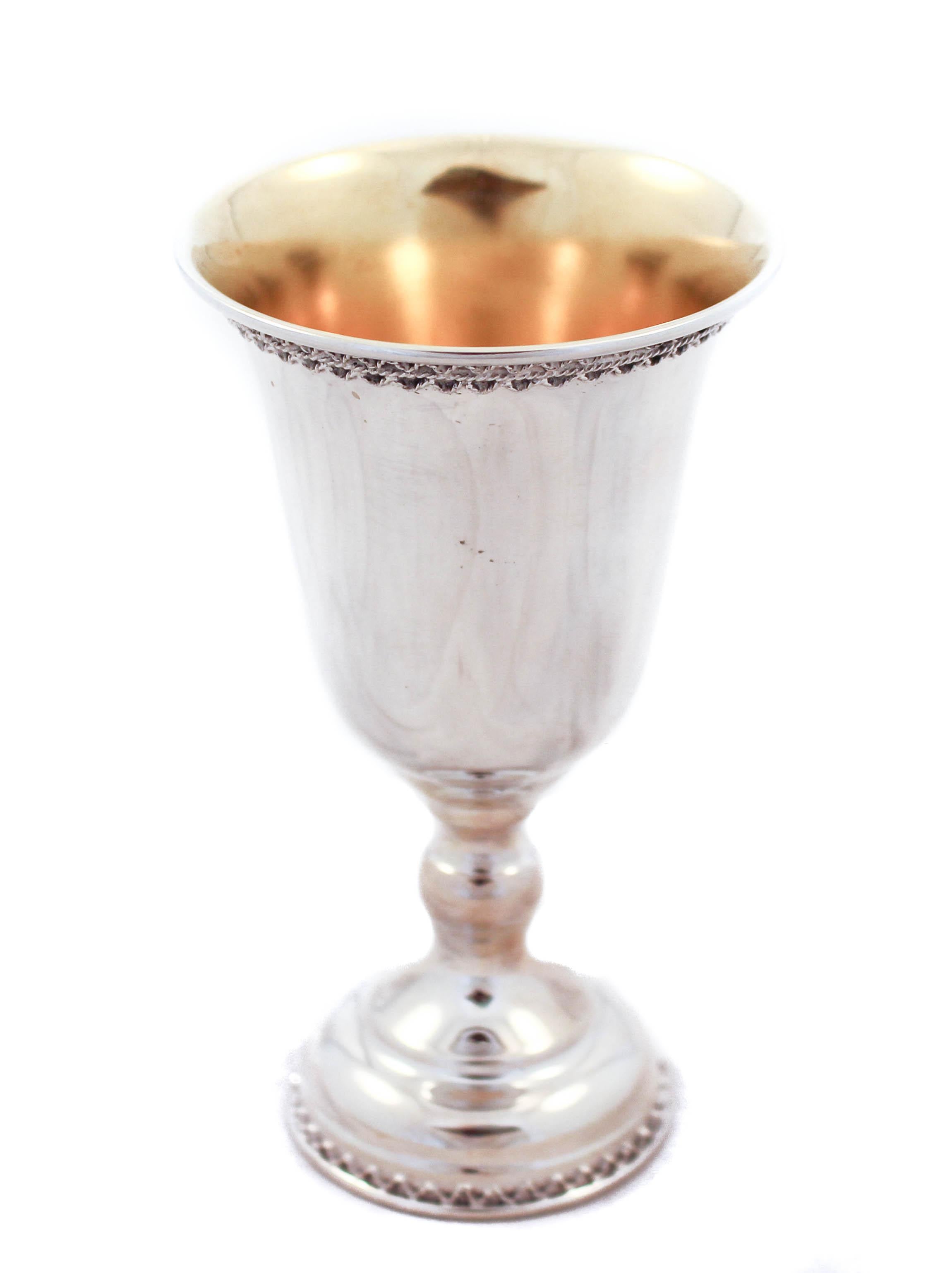 Being offered is a sterling silver goblet. It has a gadroon design around the base and on top along the rim. It has a gold washed on the inside to protect it from water-spots. Perfect for holidays (Passover) and get togethers.