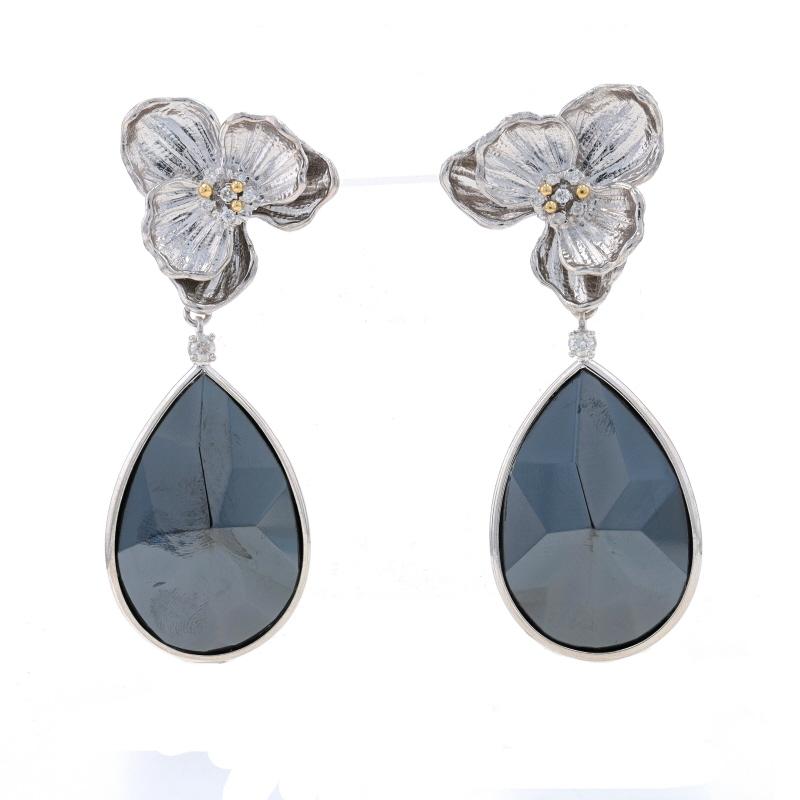 Metal Content: Sterling Silver (with gold plated accents) & 14k White Gold (backs)

Stone Information
Natural Hematite
Cut: Pear
Color: Grey

Natural Diamonds
Carat(s): .28ctw
Cut: Round Brilliant

Total Carats: .28ctw

Style: Dangle
Fastening Type: