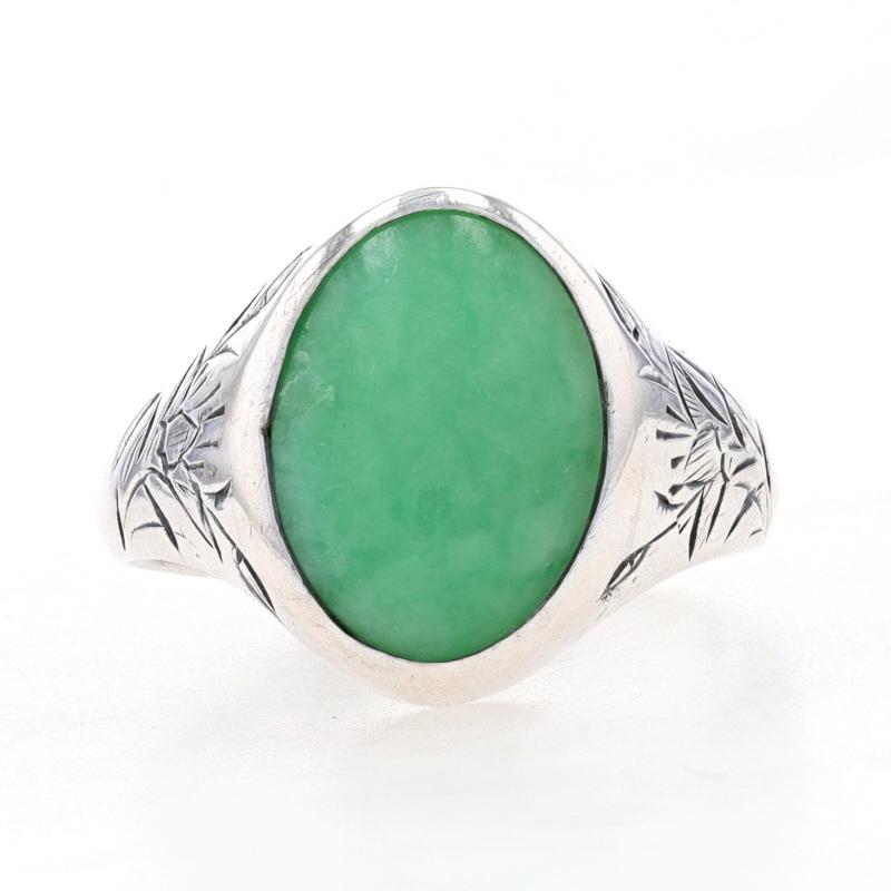 Size: 6 1/2

Era: Vintage

Metal Content: 925 Sterling Silver

Stone Information

Natural Jadeite
Treatment: Routinely Enhanced
Cut: Oval Cabochon
Color: Green

Style: Cocktail Solitaire 
Features:  Etched flower design on