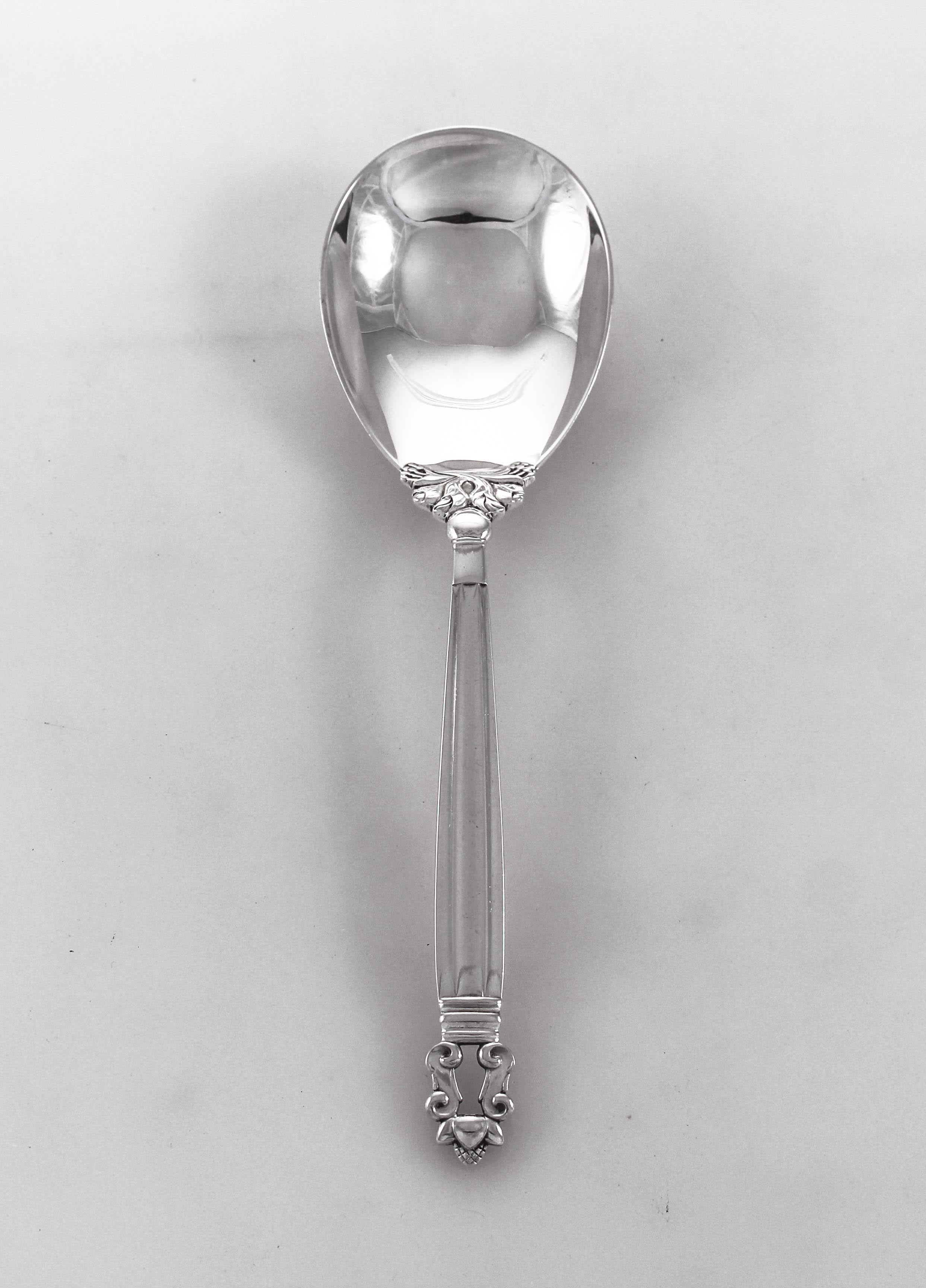 We are delighted to offer this sterling silver salad set In the Acorn pattern by the world renowned Danish silversmith Georg Jensen. Celebrated as the finest silversmith, Jensen silver pieces are very sought after. This fork and spoon set will be