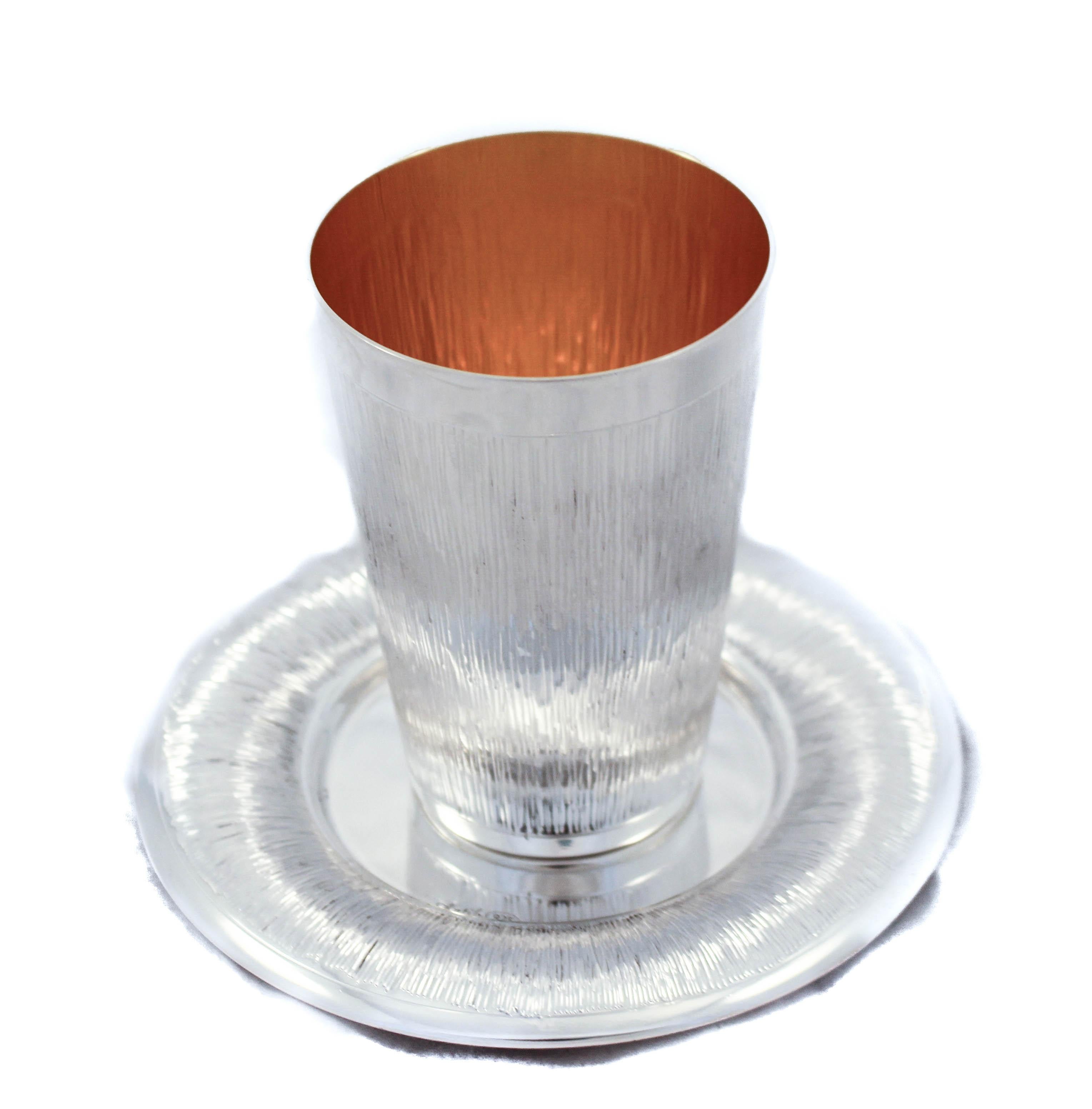 We are happy to offer you this sterling silver wine cup and plate. It has a masculine striped design with a matte finish. The plate has the same design along the edge. The inside is hold-washed to protect it from water-spots. Modern and
