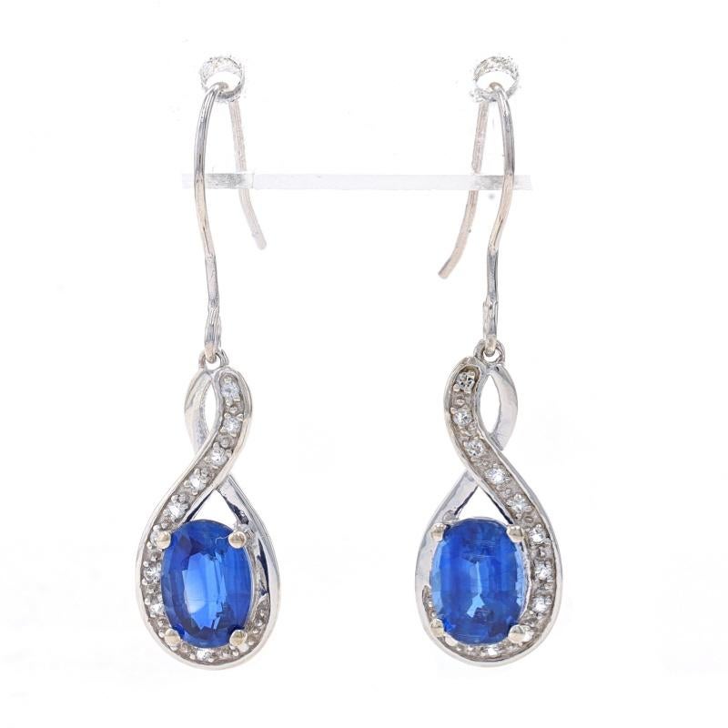 Metal Content: Sterling Silver

Stone Information

Natural Kyanite
Carat(s): 1.60ctw
Cut: Oval
Color: Blue

Natural White Topaz
Carat(s): .20ctw
Cut: Round

Total Carats: 1.80ctw

Style: Dangle
Fastening Type: Fishhook Closures
Theme: