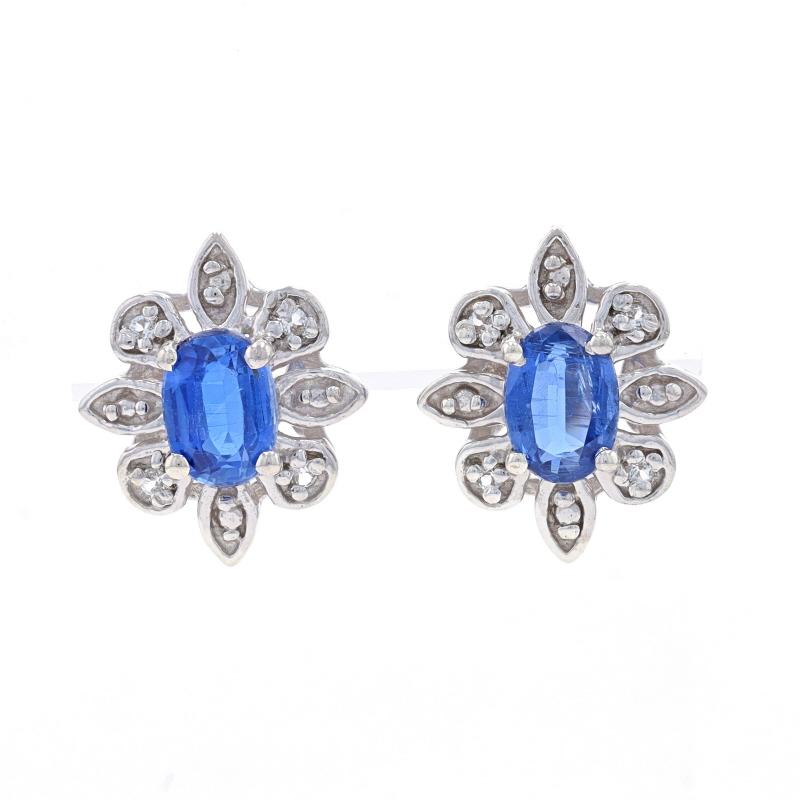 Metal Content: Sterling Silver

Stone Information

Natural Kyanite
Carat(s): 1.45ctw
Cut: Oval
Color: Blue

Natural White Topaz
Carat(s): .08ctw
Cut: Round

Total Carats: 1.53ctw

Style: Large Stud
Fastening Type: Butterfly Closures
Theme: