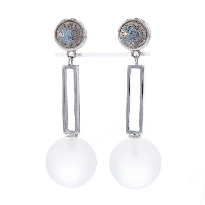 Metal Content: Sterling Silver

Stone Information
Natural Labradorite
Cut: Round Cabochon

Natural White Quartz
Cut: Round Bead
Stone Note: Matte Finish

Style: Dangle
Fastening Type: Butterfly Closures
Theme: Geometric

Measurements
Tall: 1 9/16