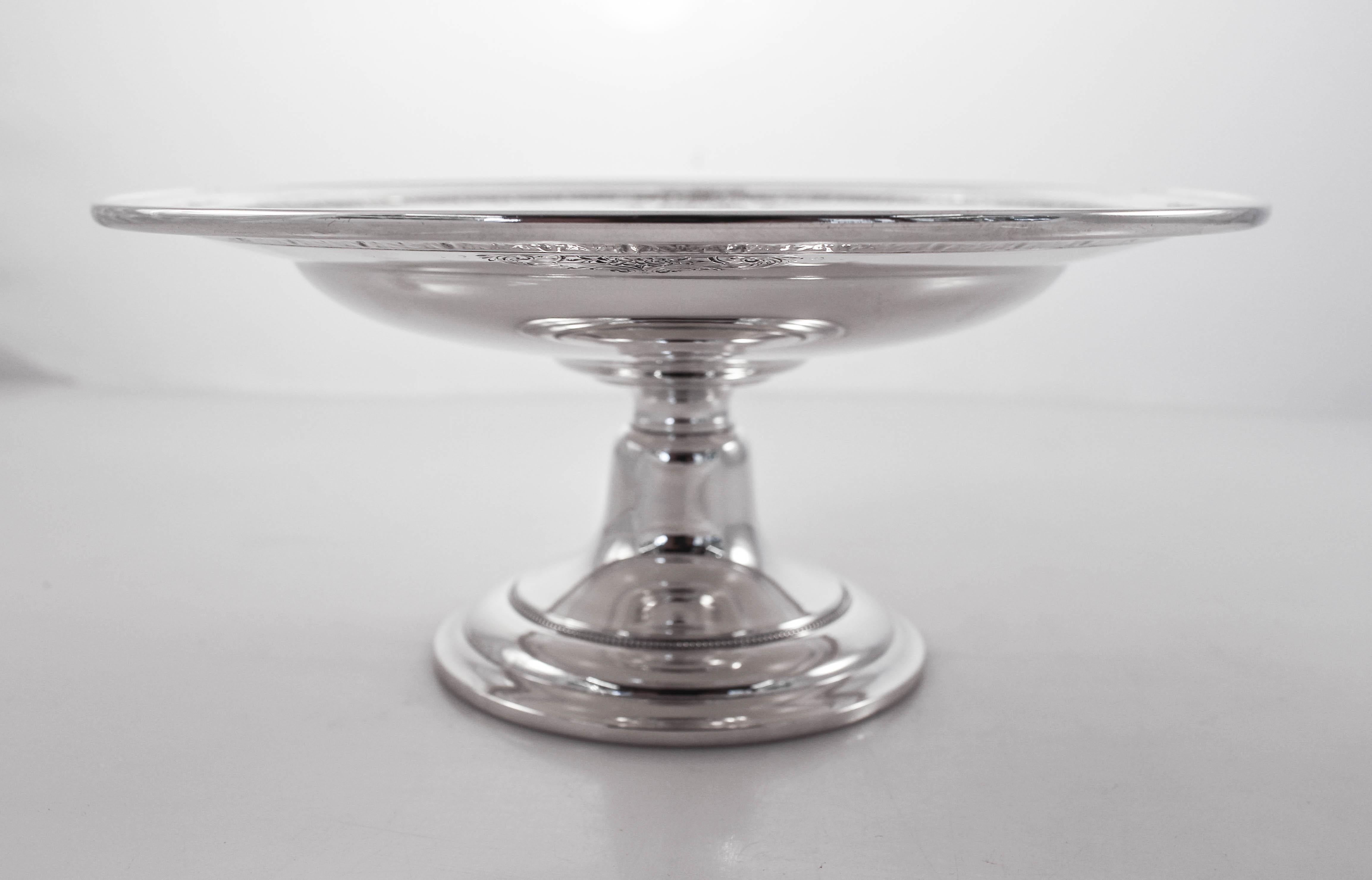 Offered here is a sterling silver tazza in the Lady Constance pattern by Towle Silversmith. AN elegant etched motif decorates the border. The base is not weighted. A good size for pastries and/or dried fruit.