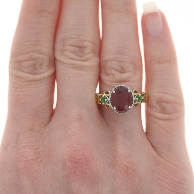 Sterling Lead Glass Filled Ruby & Chrome Diopside Ring 925 Gold Pltd Oval 8 1/4

Stone Information:
Natural Ruby
Treatments: Heated & Lead Glass Filled
Cut: Oval
Color: Red

Natural Chrome Diopside
Cut: Round
Color: Green

Additional Information: