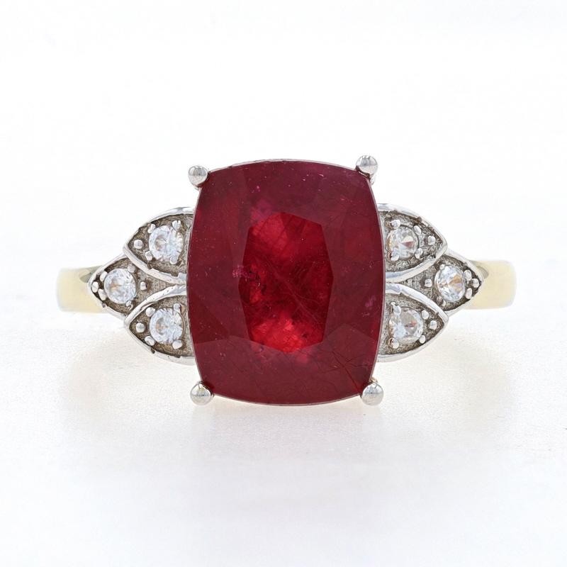 Size: 6 1/4

Metal Content: 925 Sterling Silver (Gold Plated)

Stone Information
Lead Glass Filled Ruby
Treatments: Heated & Lead Glass Filled
Carat: 3.20ct
Cut: Cushion
Color: Red

Natural White Topaz
Carats: .18ctw
Cut: Round

Total Carats: