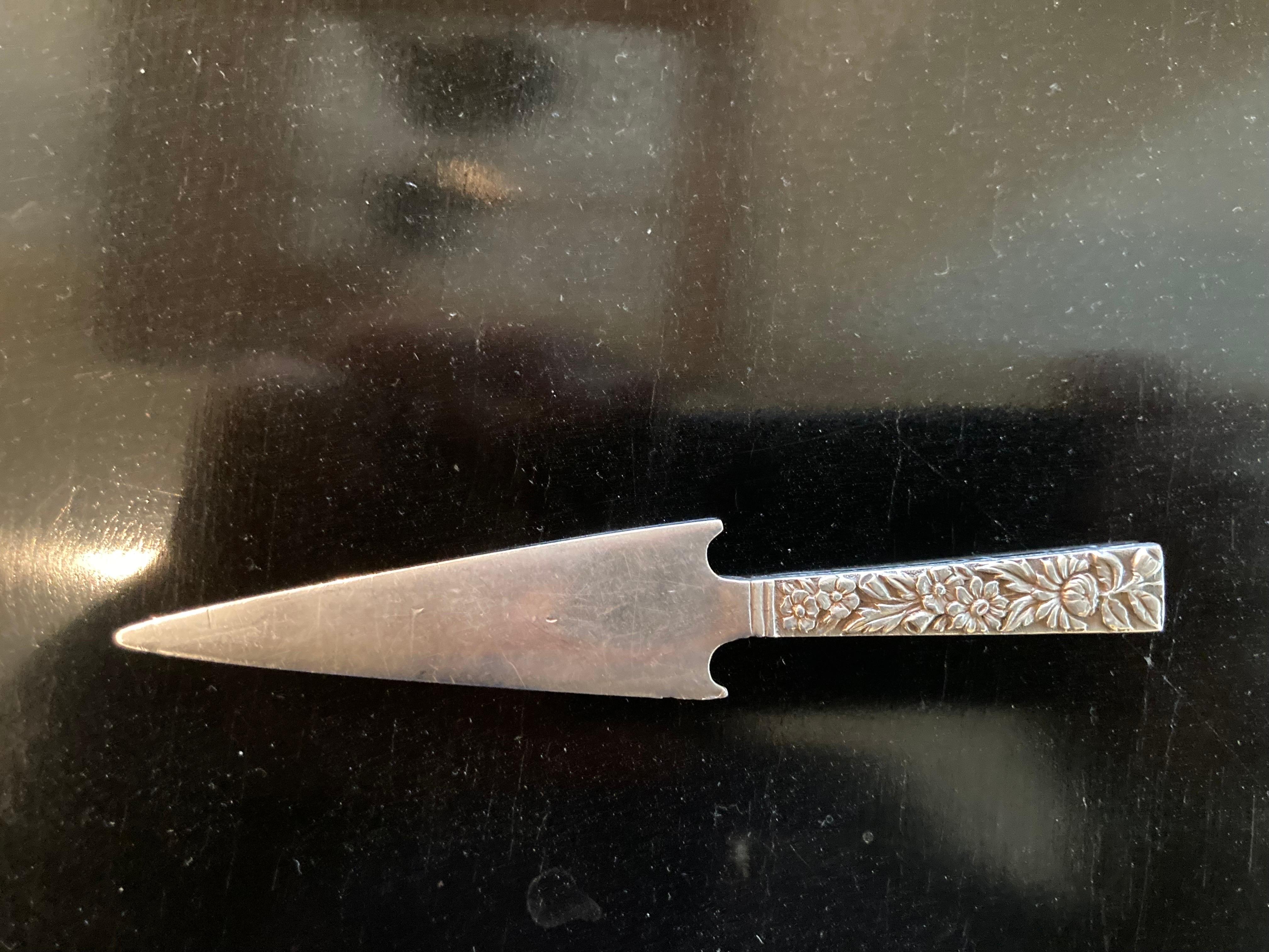Lovely sterling silver letter opener with floral handle stamped S. Kirk.