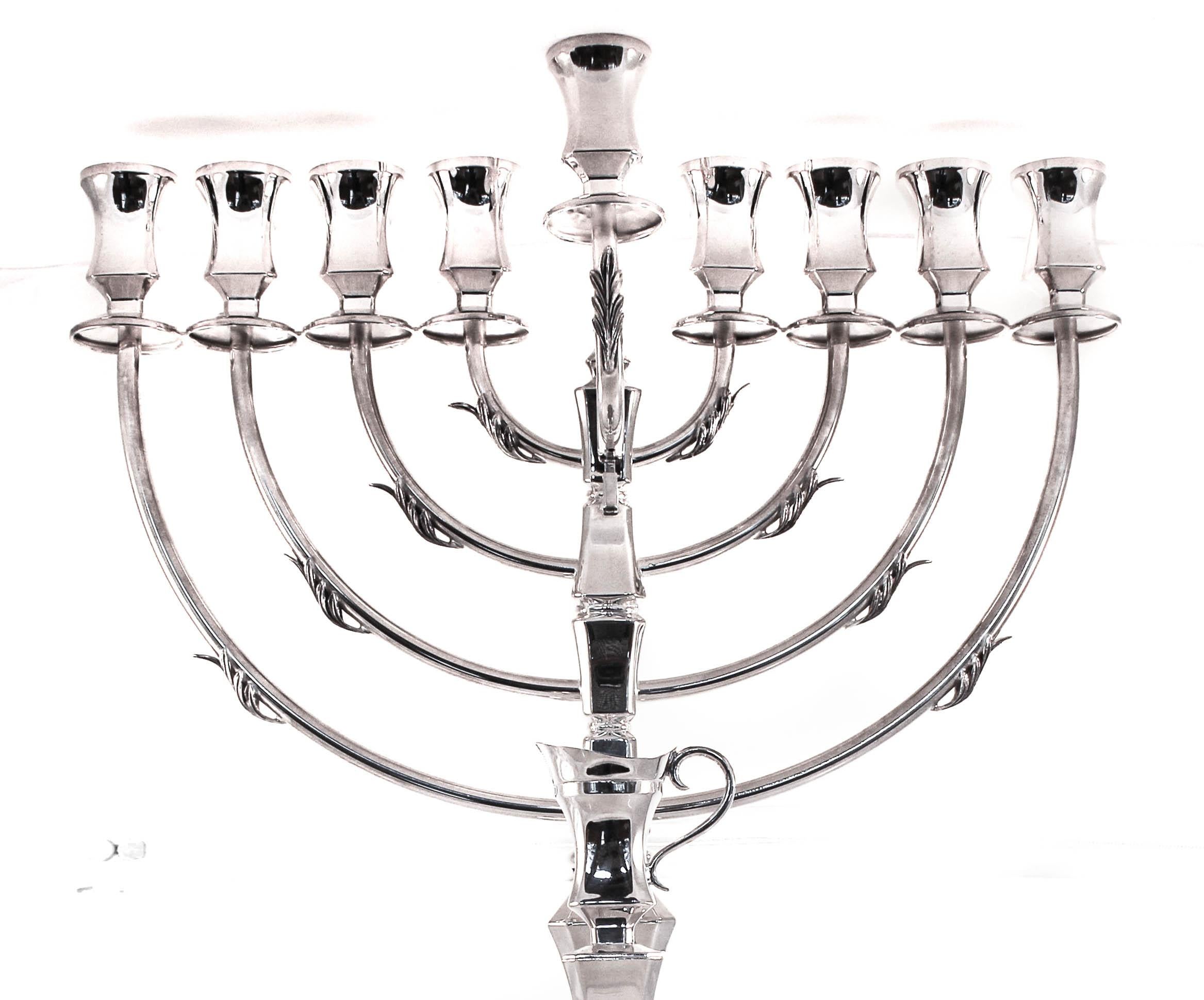 For the person who likes a modern look but with just a little detail, this menorah is sure to please. This sterling silver piece has straight lines and a tailored look but also has some detail on each branch and on the corner let’s. Modern with just