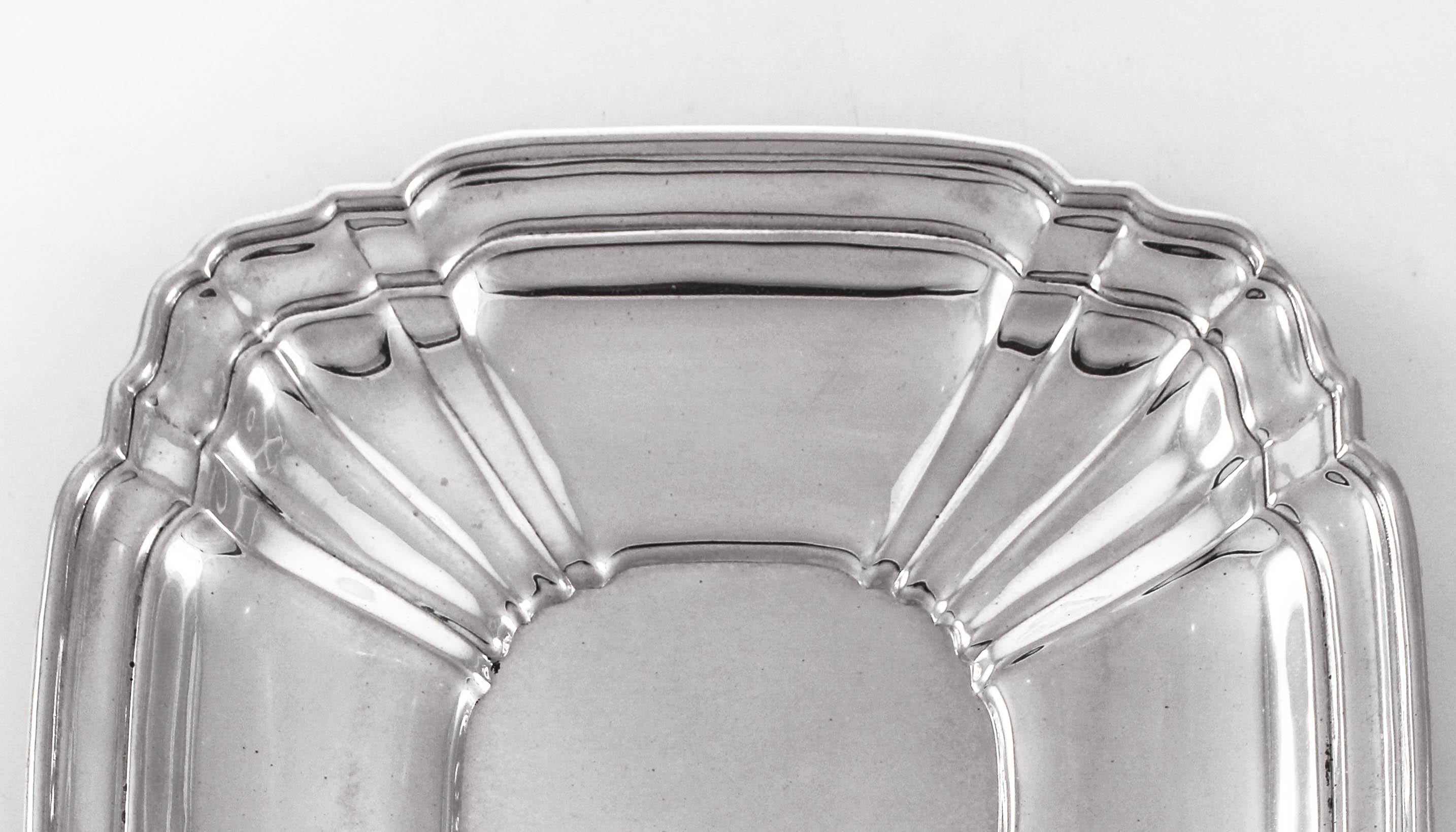 We are offering this midcentury sterling silver dish by Gorham Silver Company of Providence, Rhode Island signed 1956. It is a square shape with scalloped corners and ridges along the inside towards the center. It’s super heavy with a good solid