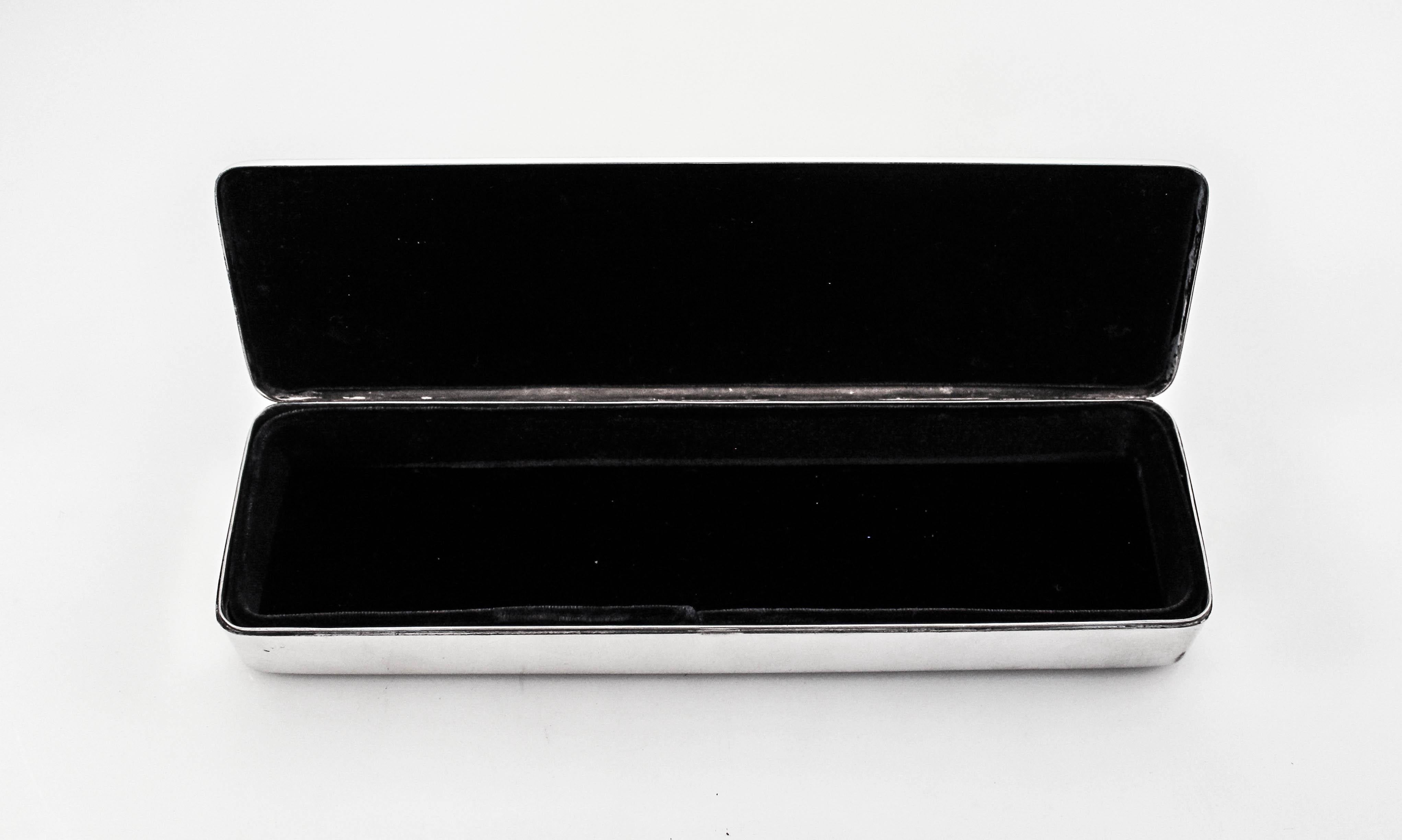 We are pleased to offer this sterling silver jewelry box by Reed & Barton. Dating back to the 1950s, this midcentury piece is exquisite. Uber-sleek and clean it’s all about the curves and shape. We had the inside re-lined in velvet dark blue, that