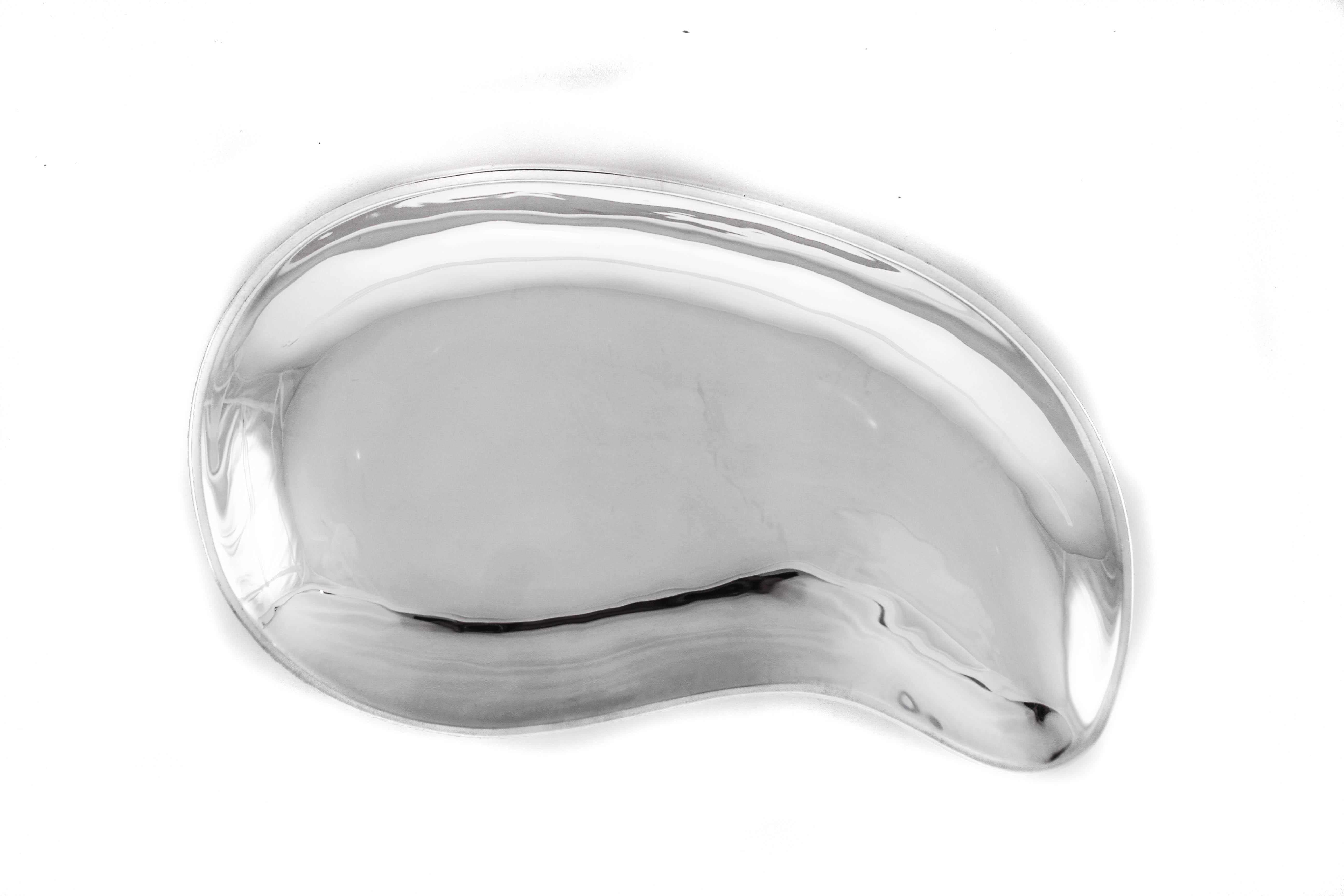 The 1950s was all about abstract and modernism and here we have a perfect example of the two fused together. This sterling silver dish has an abstract shape and is simple with no ornamentation. The modernism period was defined by less and simpler