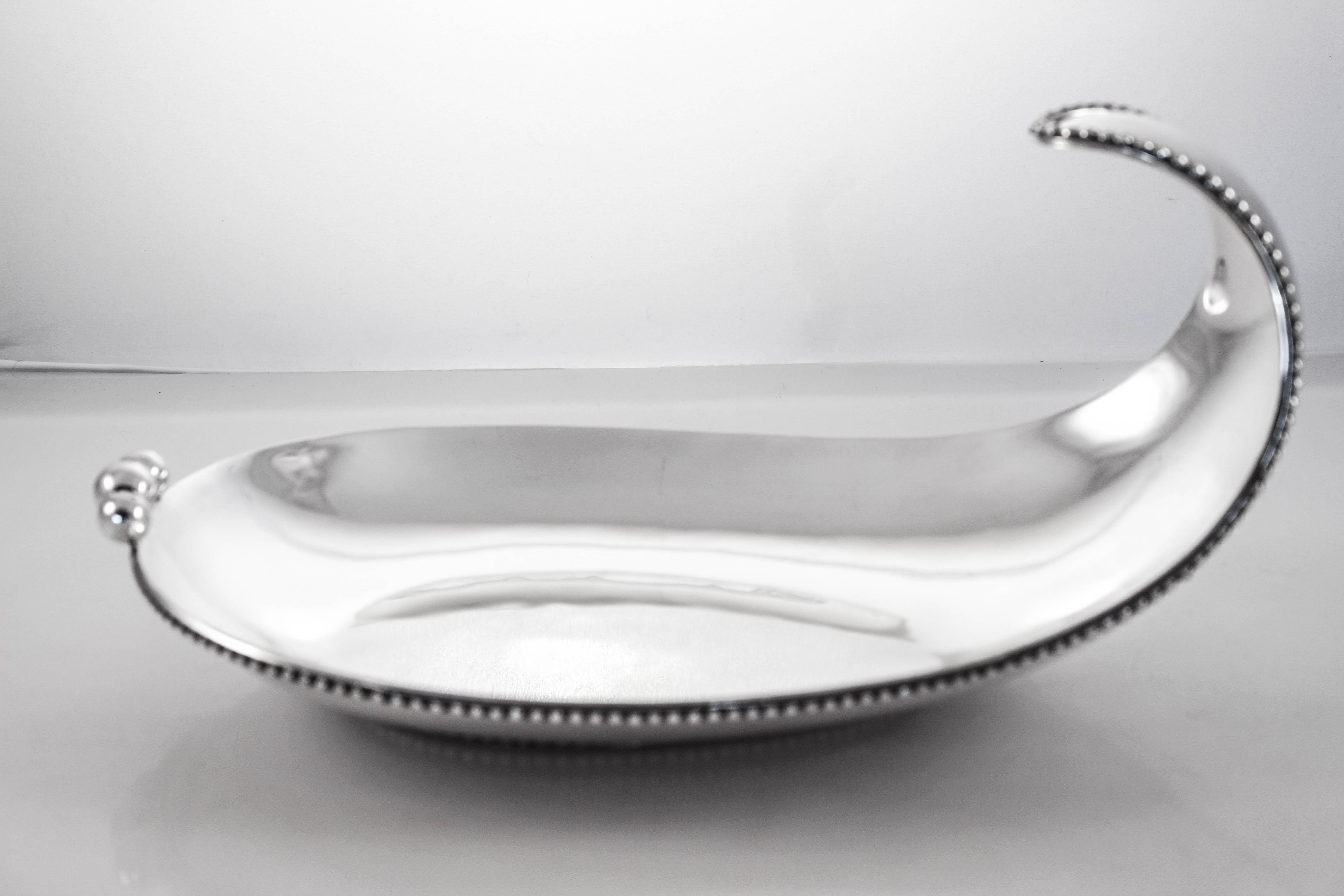 Mexican silversmiths we’re experimenting with modernism long before it became popular in the USA. This sterling silver dish has a truly unique shape. It curves up on one side and almost folds over, reminds me of a wave about to come crashing down.