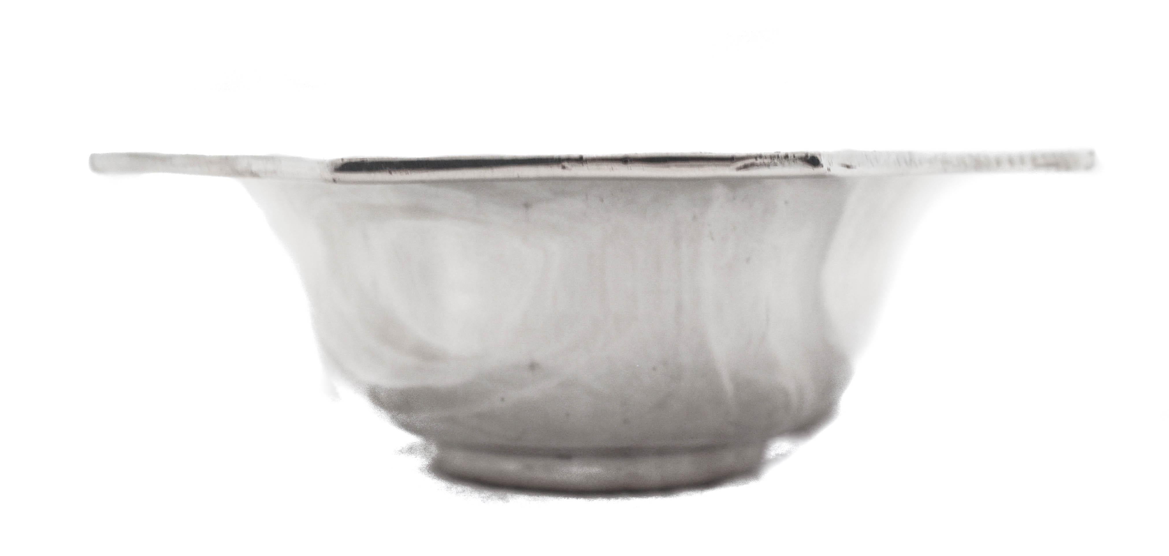 Being offered is a mid-century sterling silver candy bowl from the 1950’s. It is uber-sleek and has no etchings or decoration— just a clean modern piece. The rim is scalloped giving it an open and airy feel. The perfect size for your bar or coffee