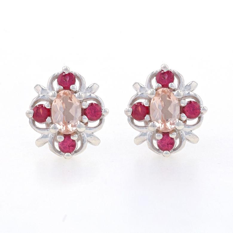 Metal Content: Sterling Silver

Stone Information

Natural Morganites
Cut: Oval
Color: Light Pink

Natural Rhodolite Garnets
Cut: Round
Color: Purplish Red

Style: Stud
Fastening Type: Butterfly Closures
Theme: Flowers
Features: Open Cut