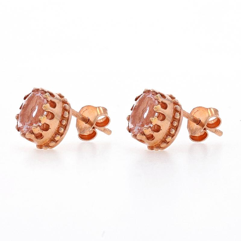 Metal Content: Sterling Silver (rose gold plated)

Stone Information

Natural Morganites
Carat(s): 1.05ctw
Cut: Oval
Color: Light Pink

Total Carats: 1.05ctw

Style: Stud
Fastening Type: Butterfly Closures

Measurements

Tall: 11/32
