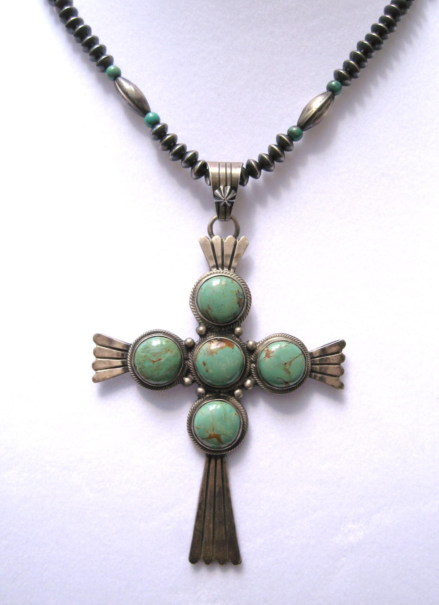 Sterling Silver Navajo Turquoise Cross, large in scale measuring 3.5 inches top to bottom (not including large bale)  x 2.5 inches wide. Chain is beaded with turquoise beading measuring 16.5 inches end to end. Patina as found.  This is out of a